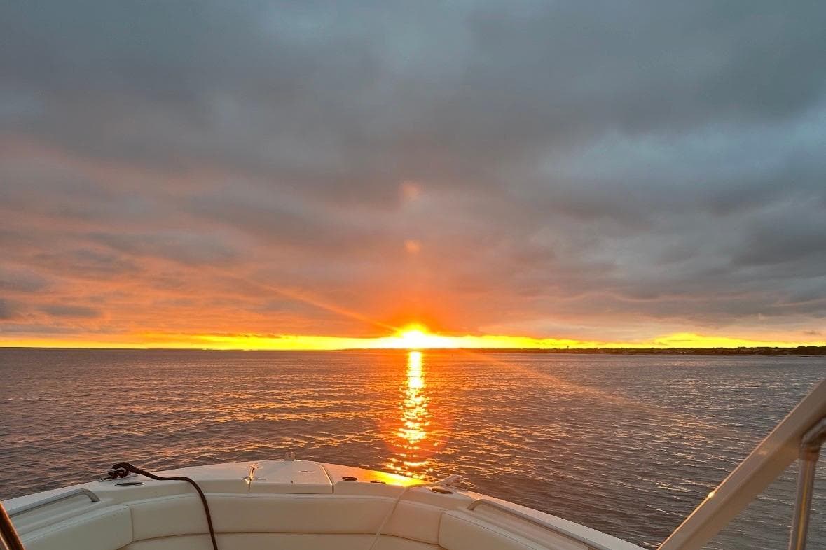 Grady-White Freedom 307 boat at sunset on the ocean, 2020 model.