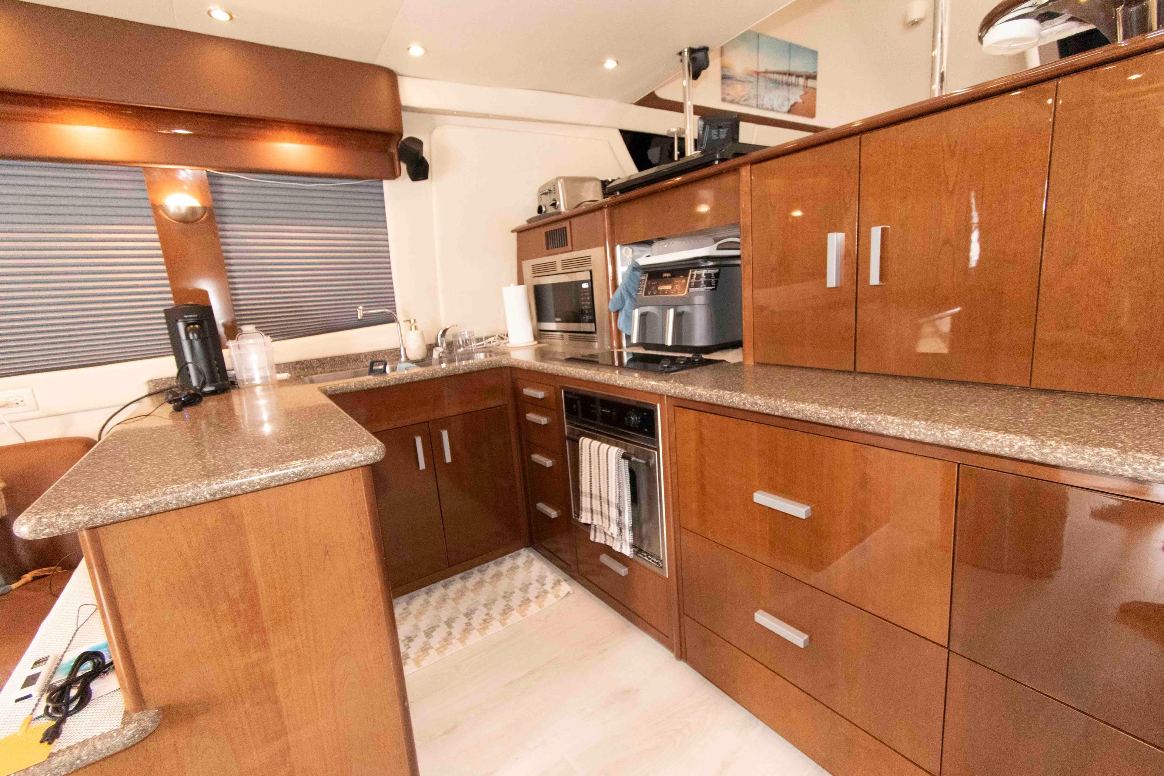 Luxurious kitchen interior of 2007 Carver 56 Voyager yacht with modern appliances.