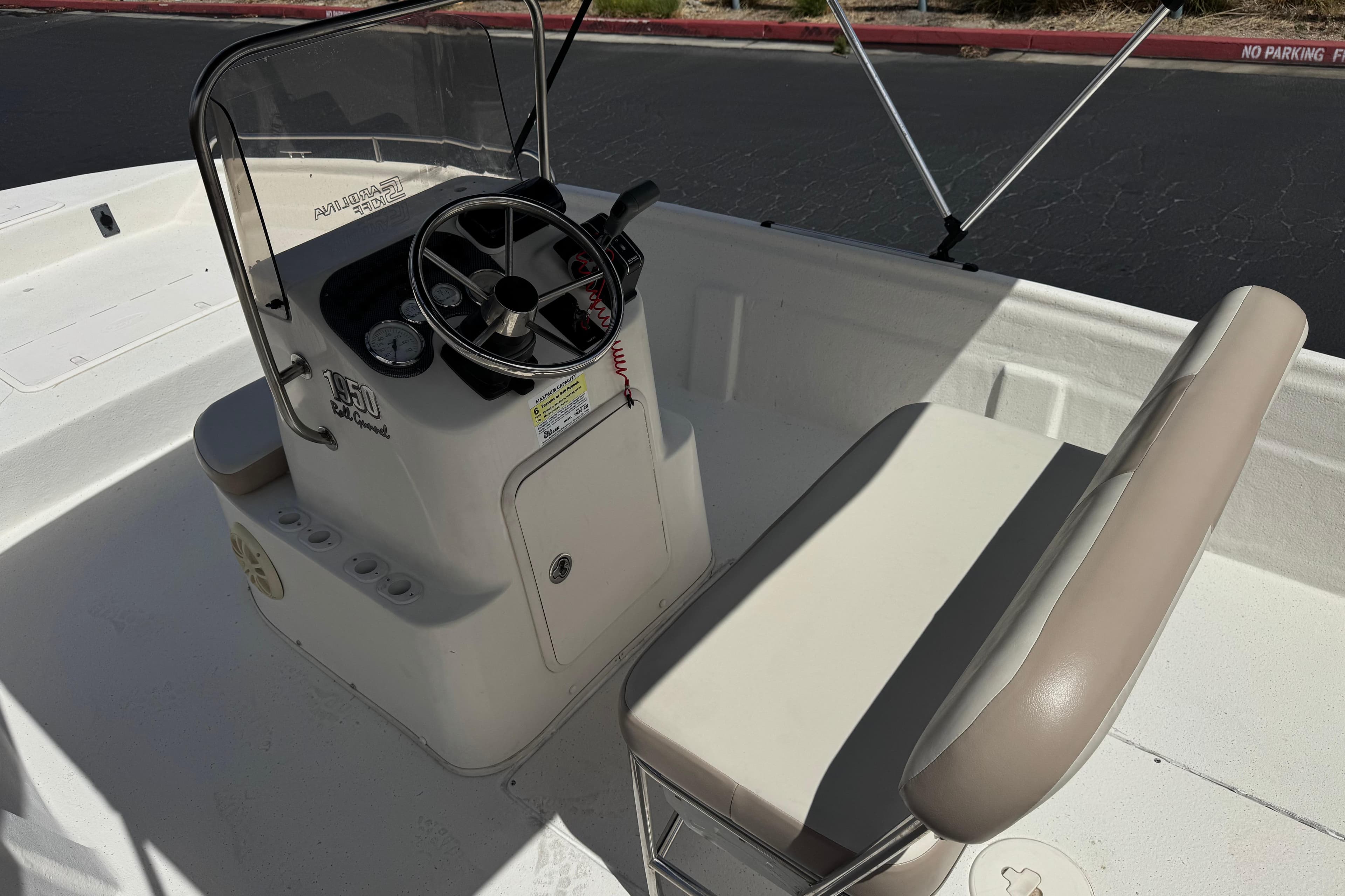 2013 Carolina Skiff Sea Chaser 1950 RG boat interior with steering console and seating.