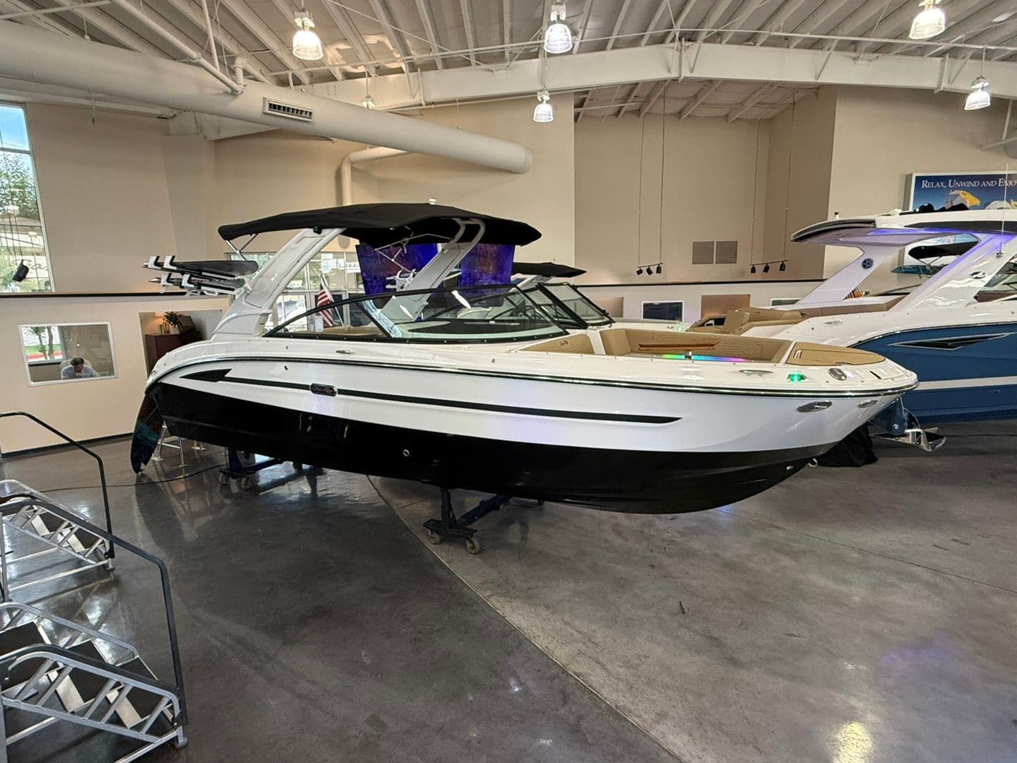 2026 Sea Ray SDX 270 Surf boat in showroom.