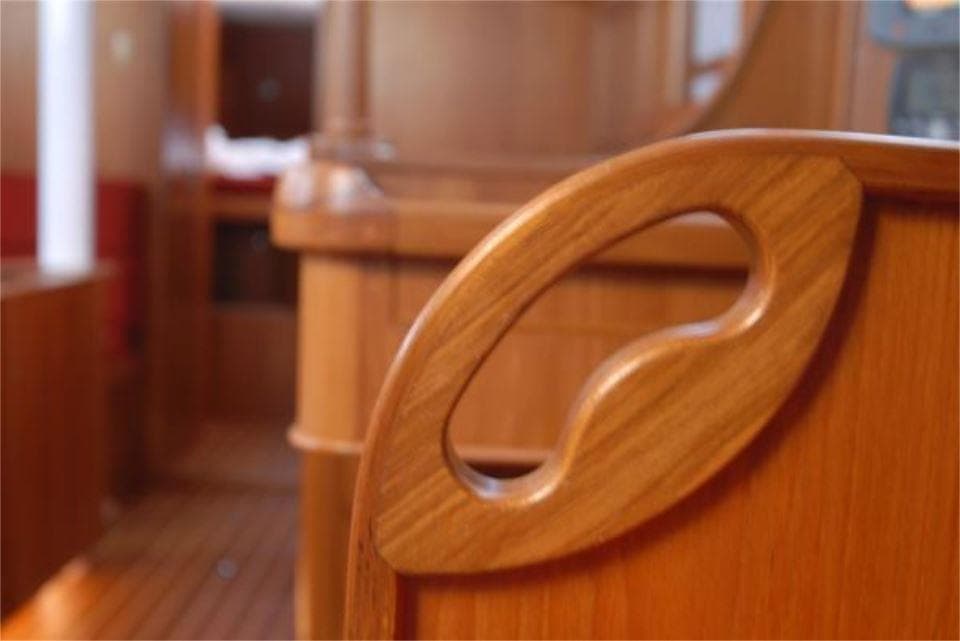 Interior of 2025 Rustler 42 yacht, featuring elegant wooden craftsmanship and design.