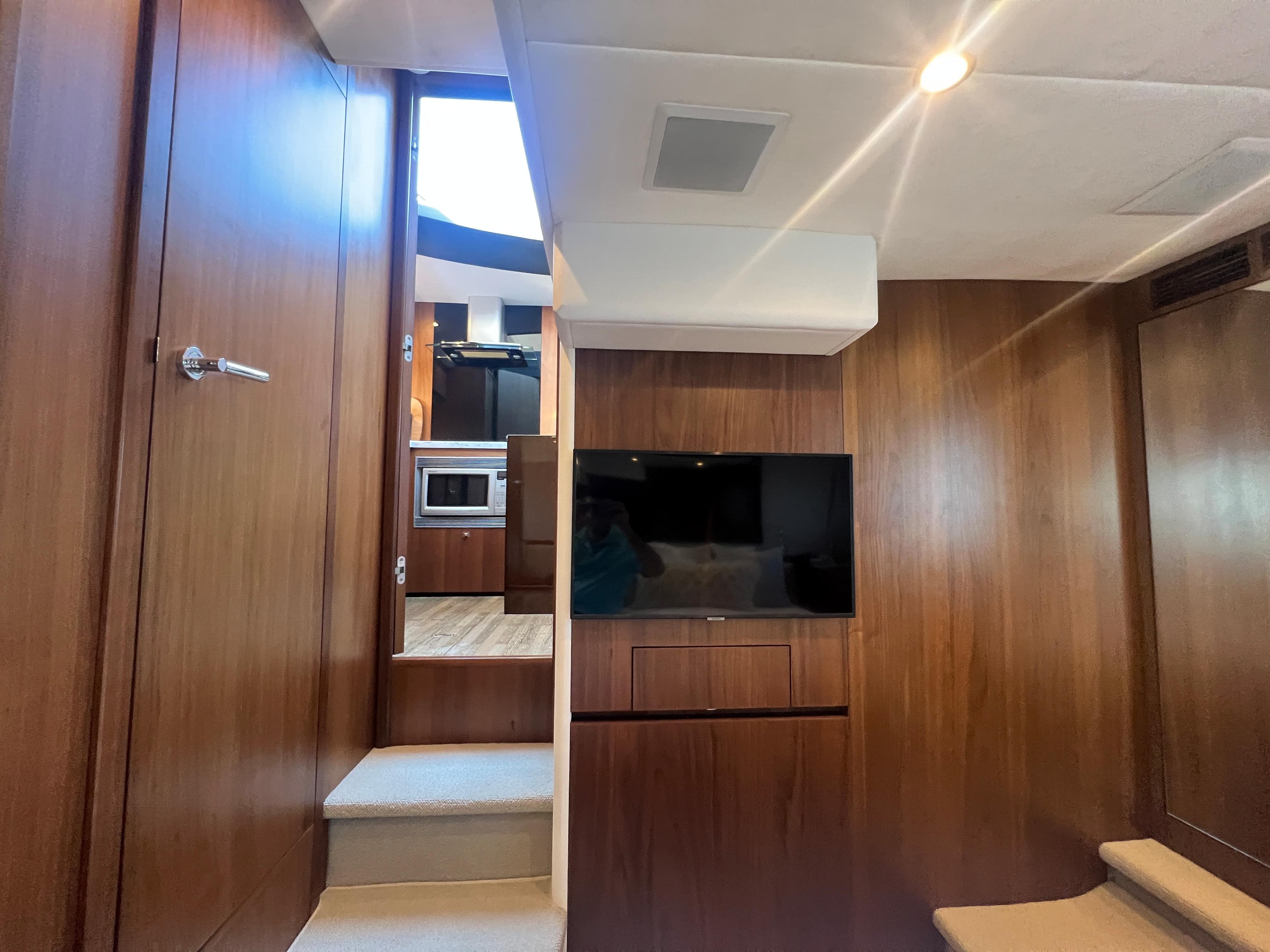 Luxurious interior of 2015 Viking Princess V52 yacht with wood paneling and modern amenities.