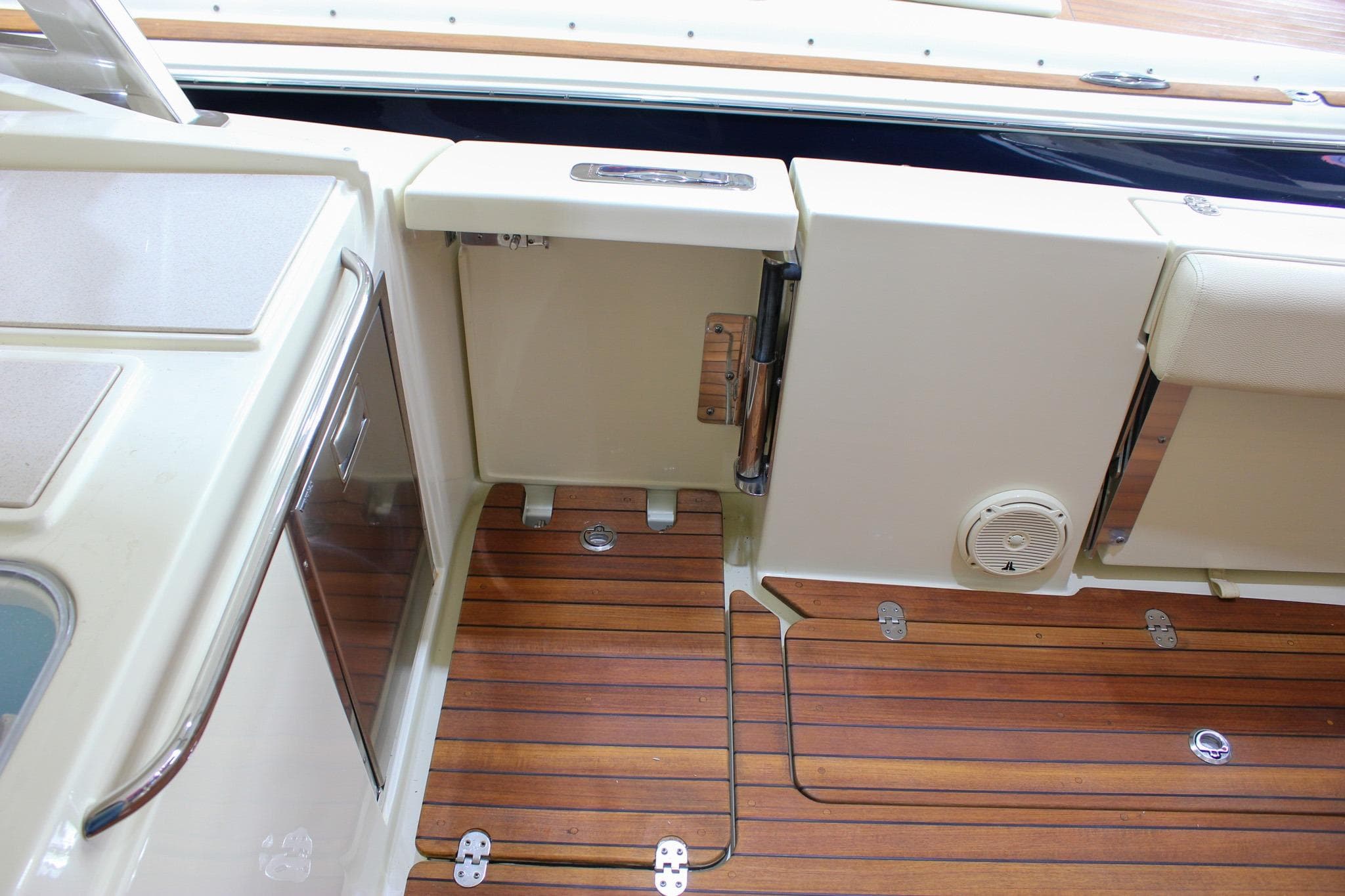 2018 Chris-Craft Calypso 30 boat interior with teak flooring and sleek design elements.