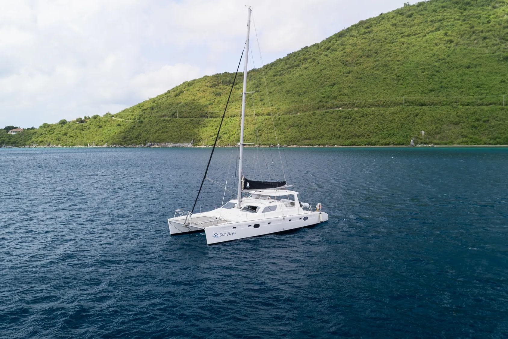Voyage Yachts VOYAGE 480 catamaran near green island, 2019 model.