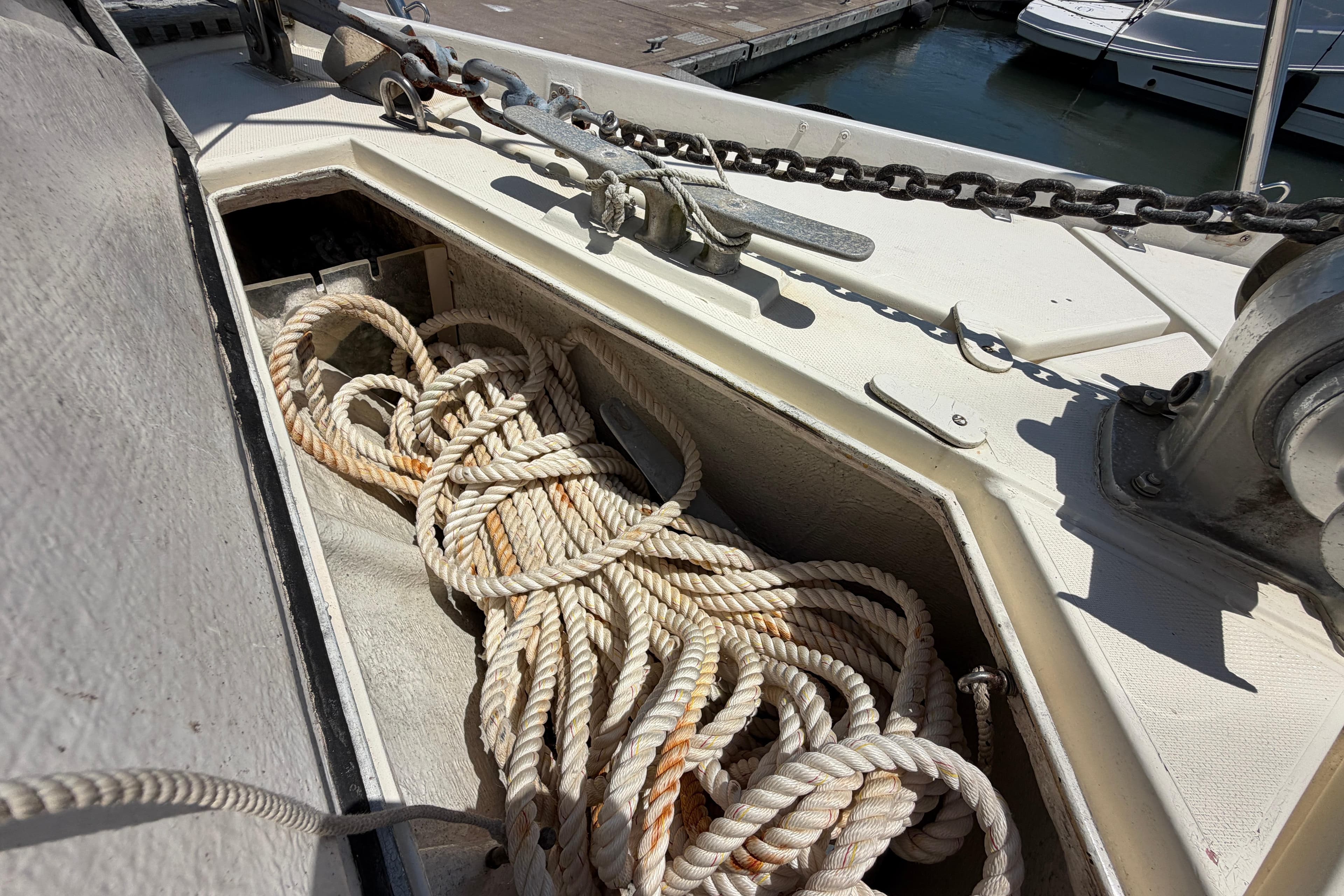 Anchor chain and rope on 1980 Amel Mango 52 sailboat deck.