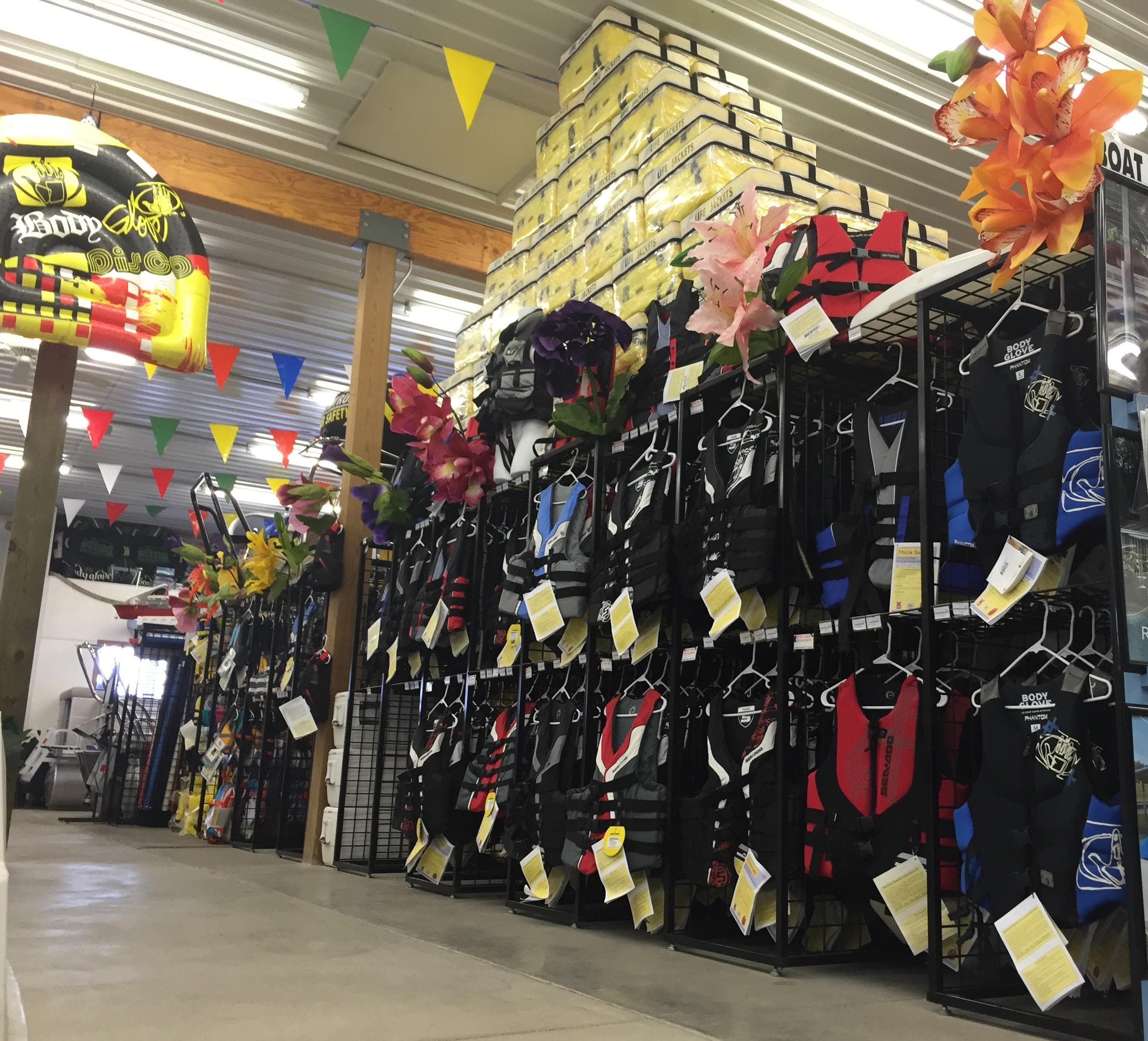 Store interior with colorful life jackets and decorations, featuring Barletta ARIA 20UC 2025 model.