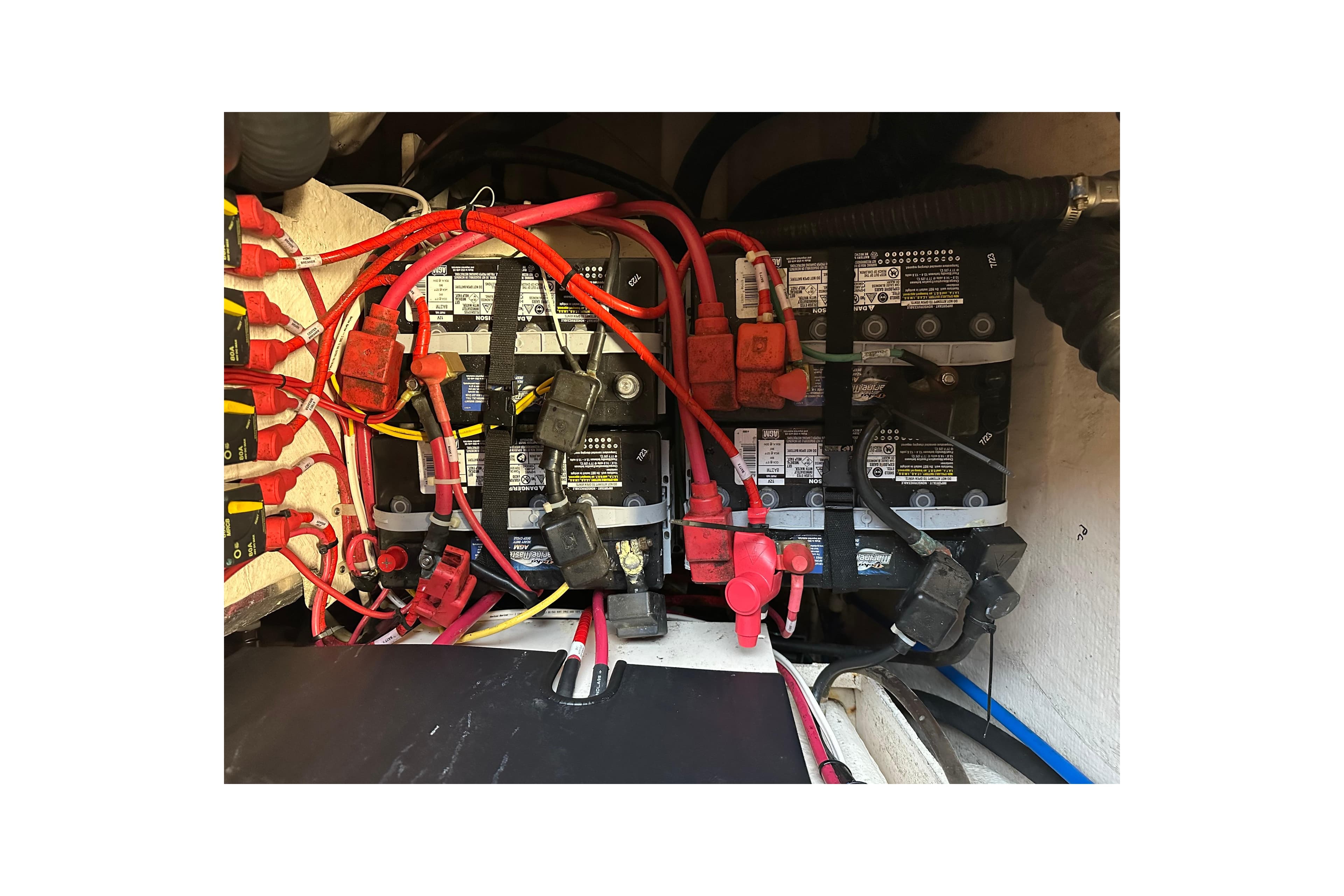 Battery compartment of a 2015 Grady-White Express 370 boat with wiring connections.