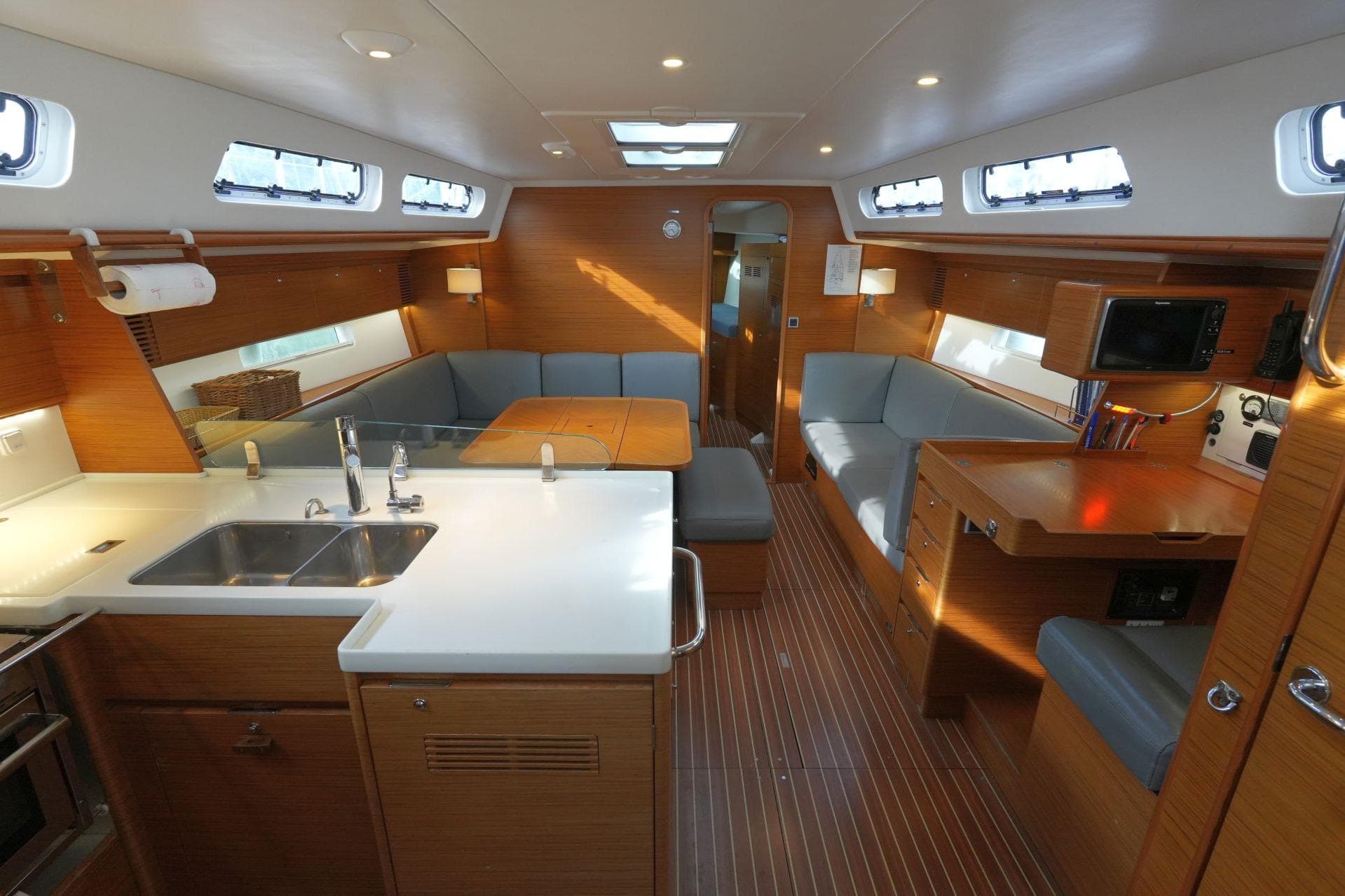 Luxurious interior of 2016 X-Yachts XC-45 MK II sailboat with modern kitchen and seating area.