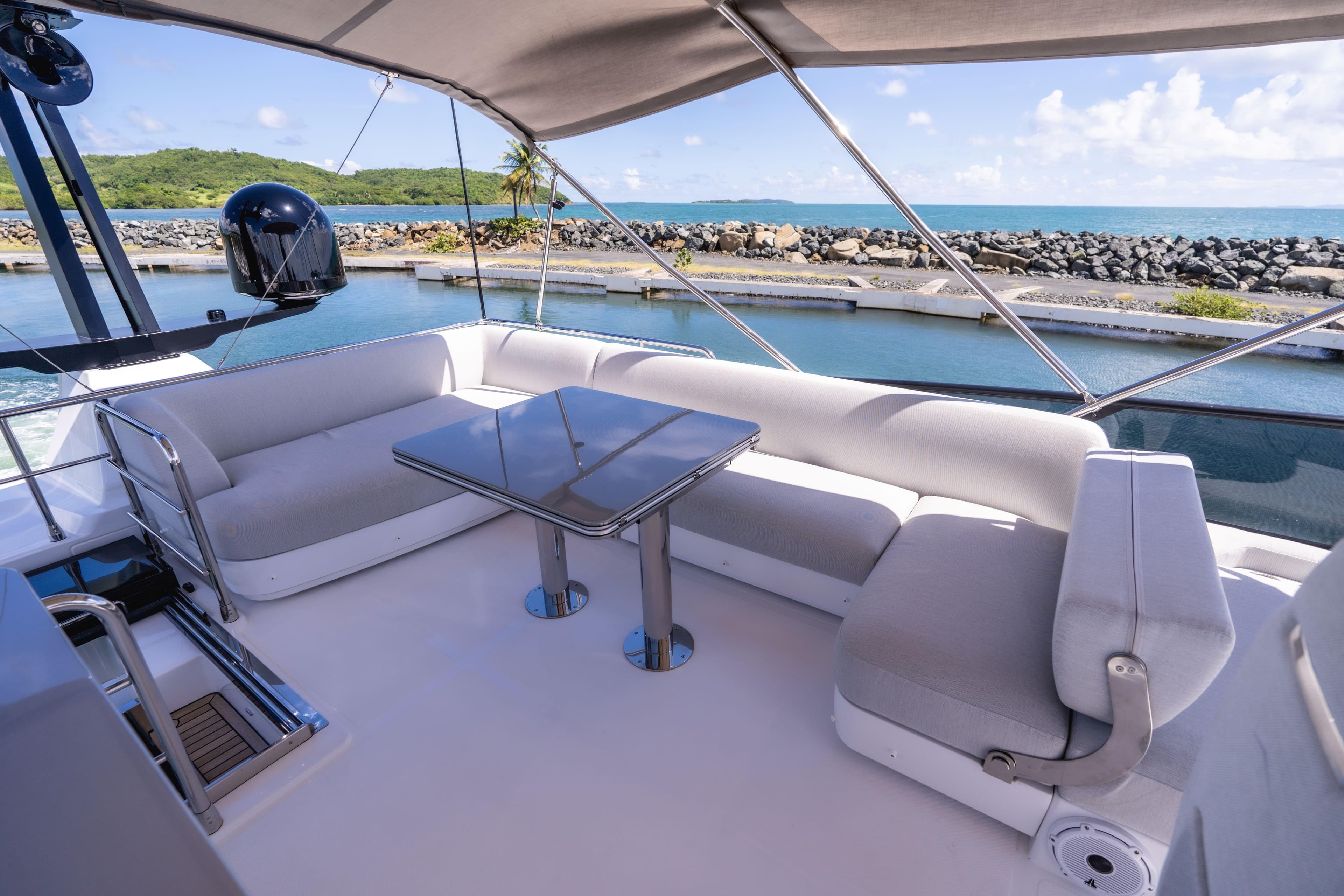 Luxurious seating area on 2024 Azimut S7 yacht with ocean view.