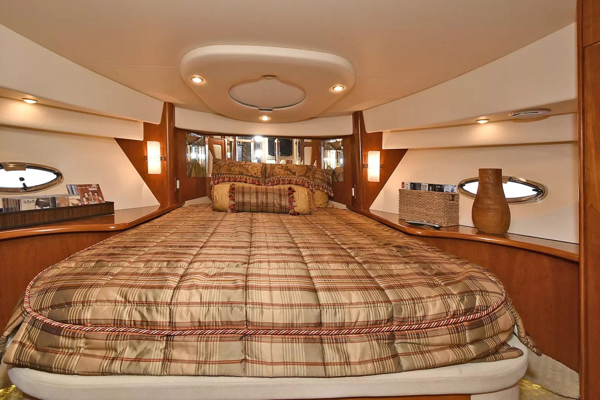 Luxurious bedroom interior of 2009 Silverton 52 Ovation yacht with elegant decor.