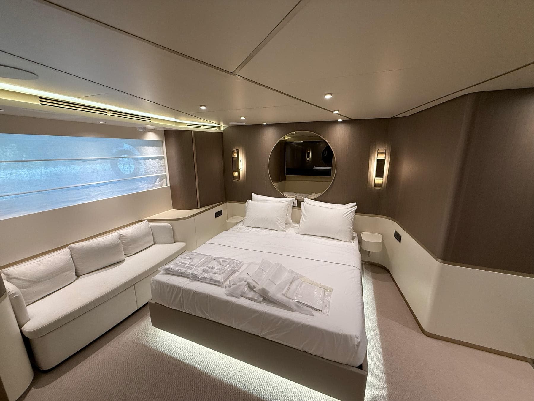 Luxurious bedroom interior of 2026 Azimut Magellano 25M yacht, featuring elegant design and modern amenities.
