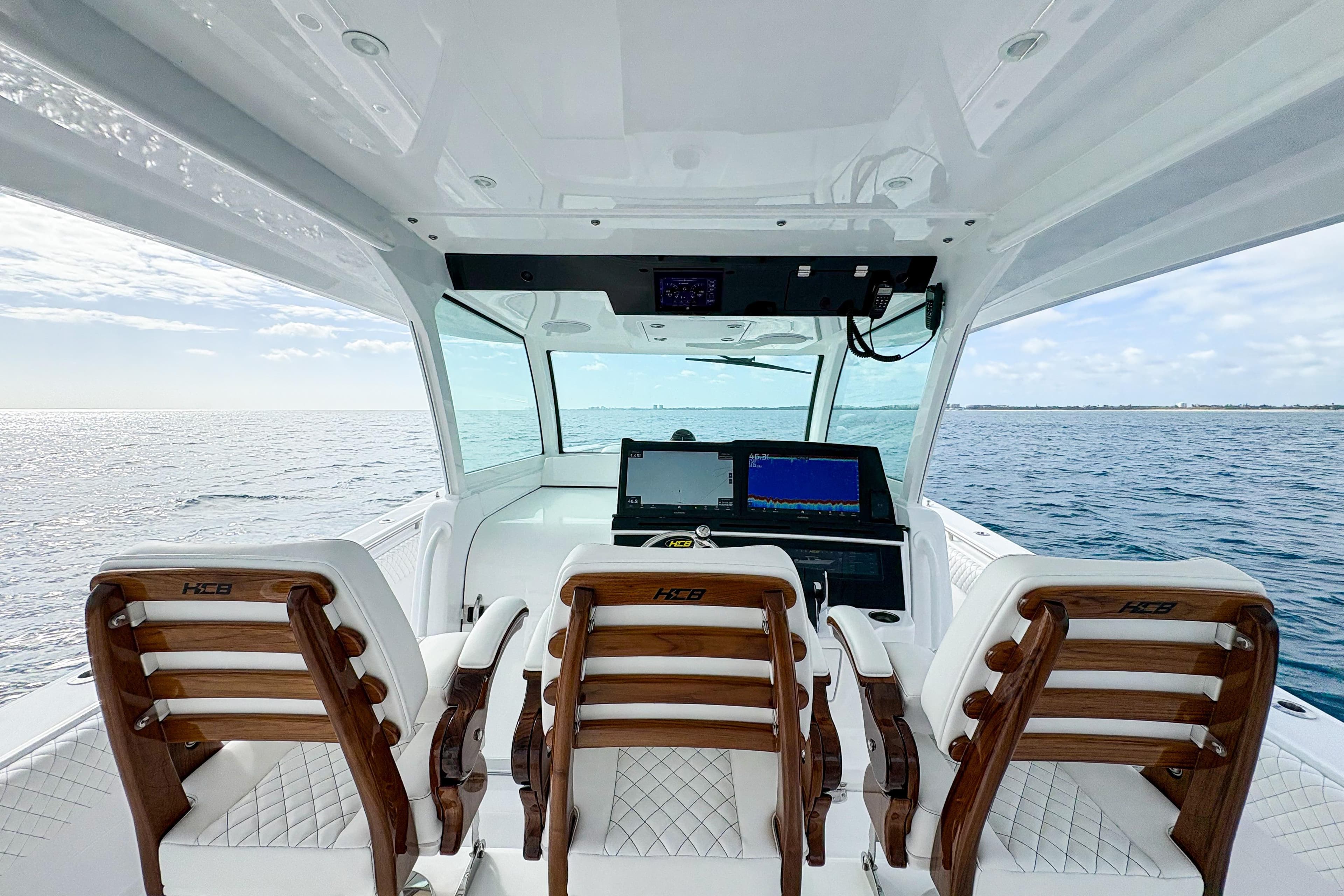 Interior view of 2027 HCB 48 Campeon boat with luxurious seating and advanced navigation system.