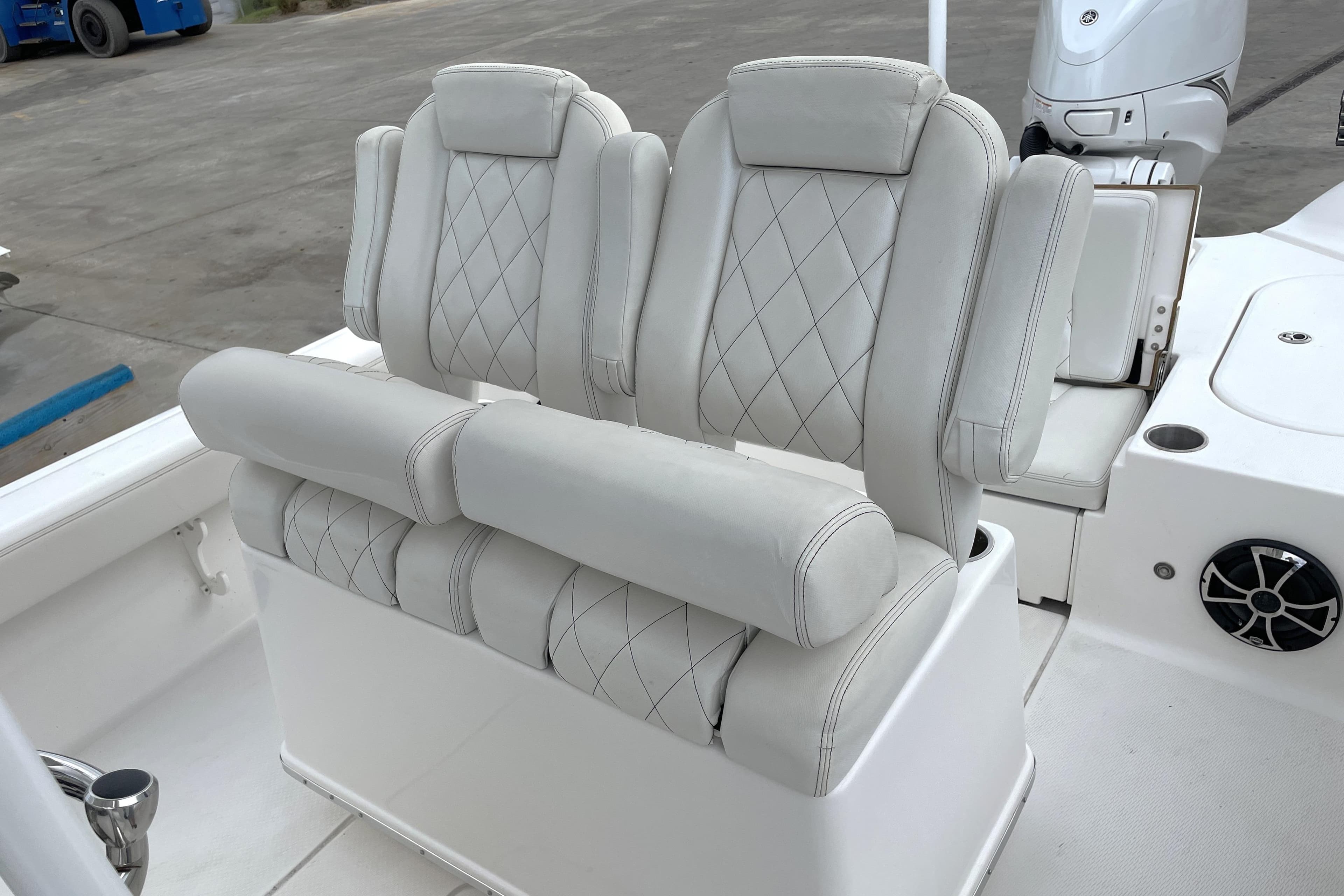 Luxurious seating on 2019 Blue Wave 2800 Pure Hybrid boat, featuring diamond-stitched upholstery.