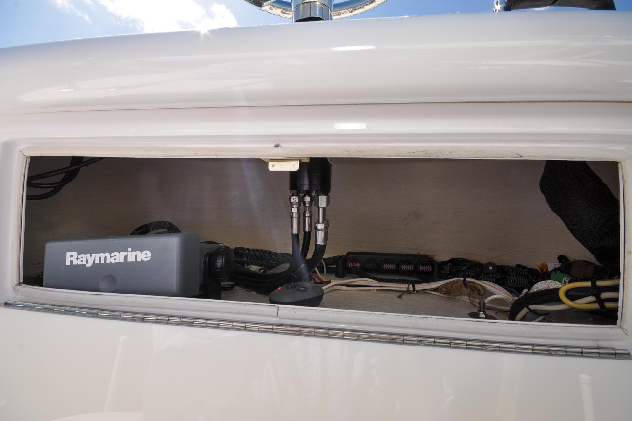 2011 Yellowfin 39 Offshore boat electronics compartment with Raymarine equipment.