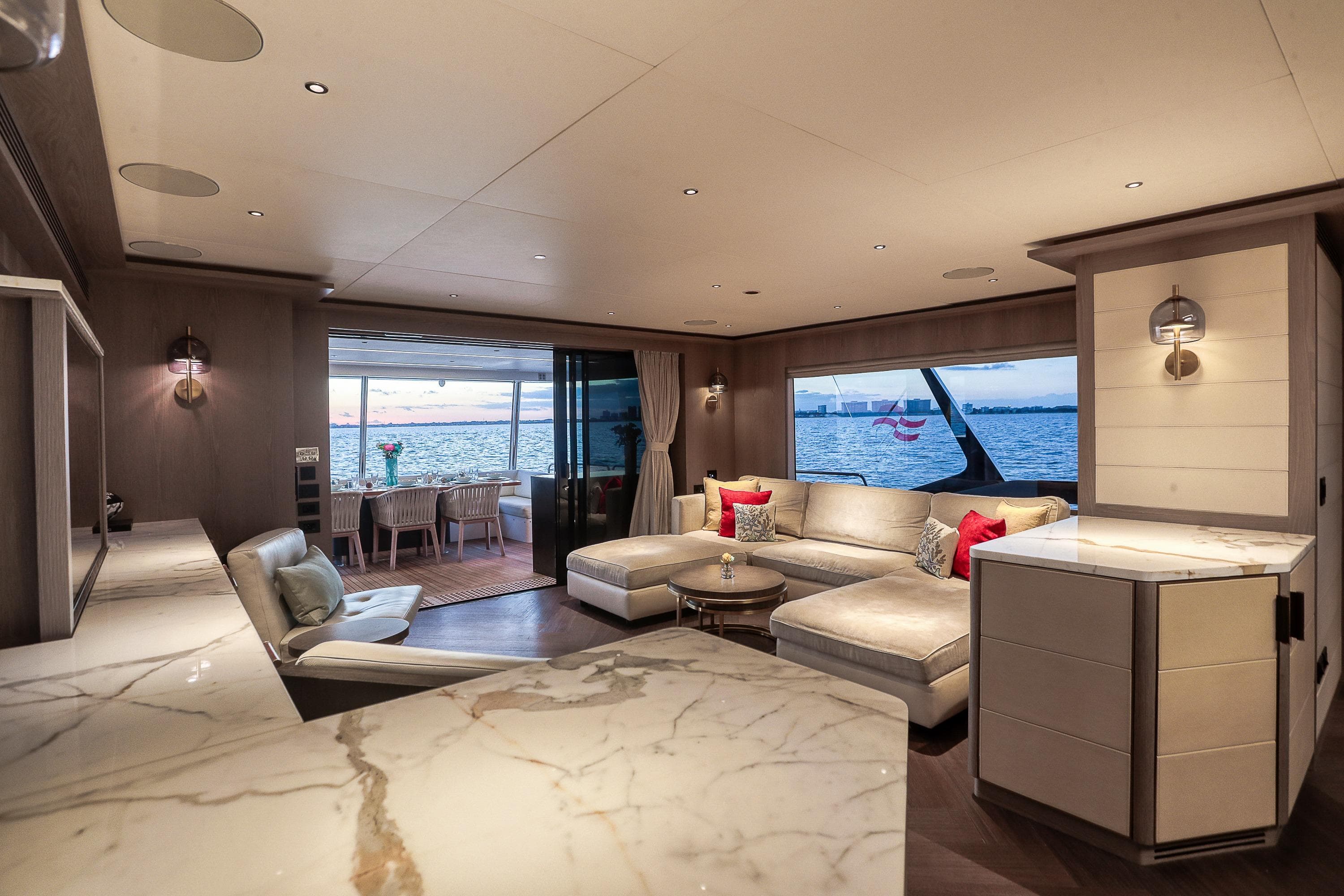 Luxurious interior of 2021 Sirena 88 yacht with elegant seating and ocean view.