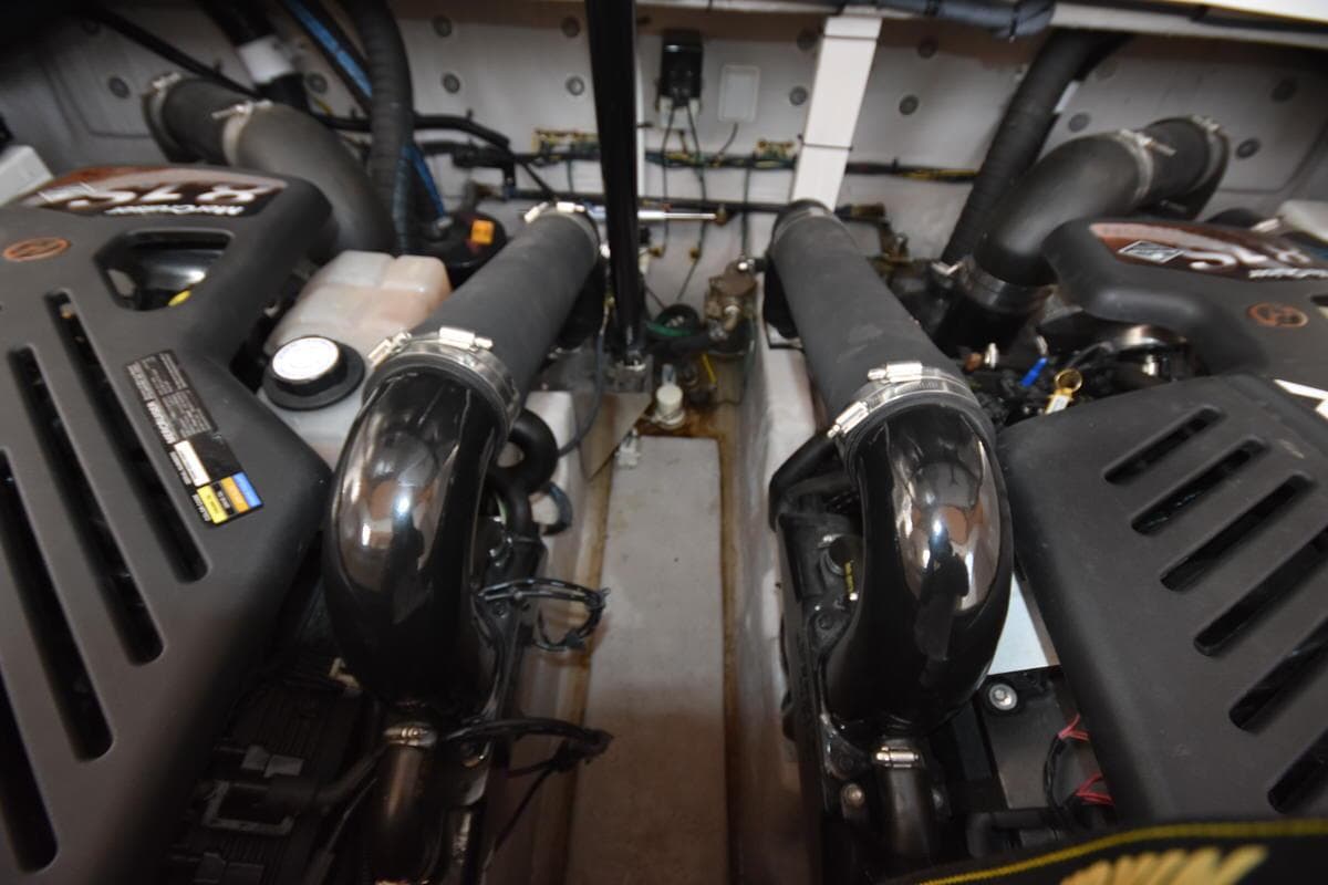 Engine compartment of a 2003 Sea Ray 360 Sundancer boat, showcasing dual engines.