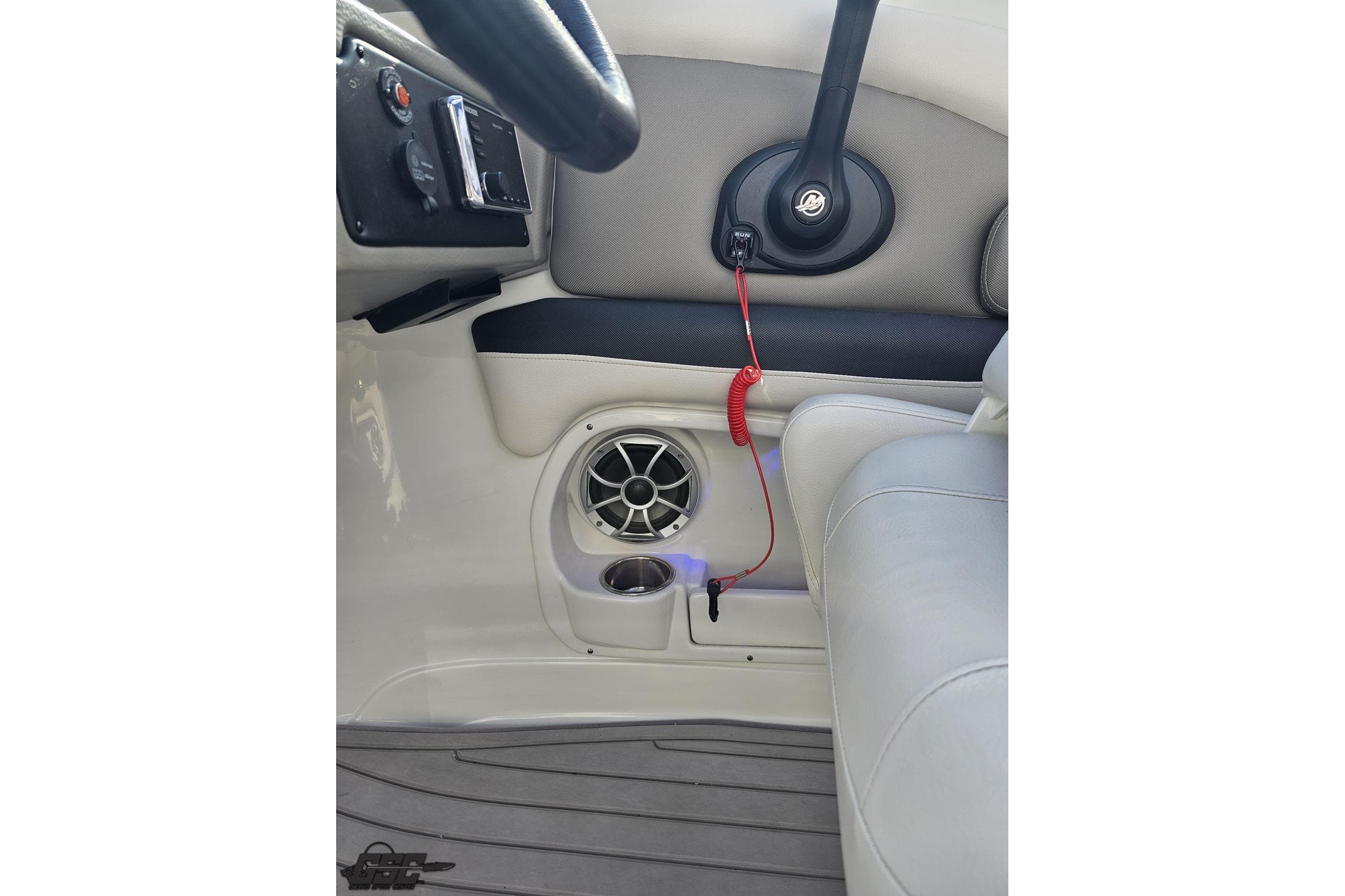 Interior of 2019 Crownline 275 SS boat showing steering wheel and speaker system.