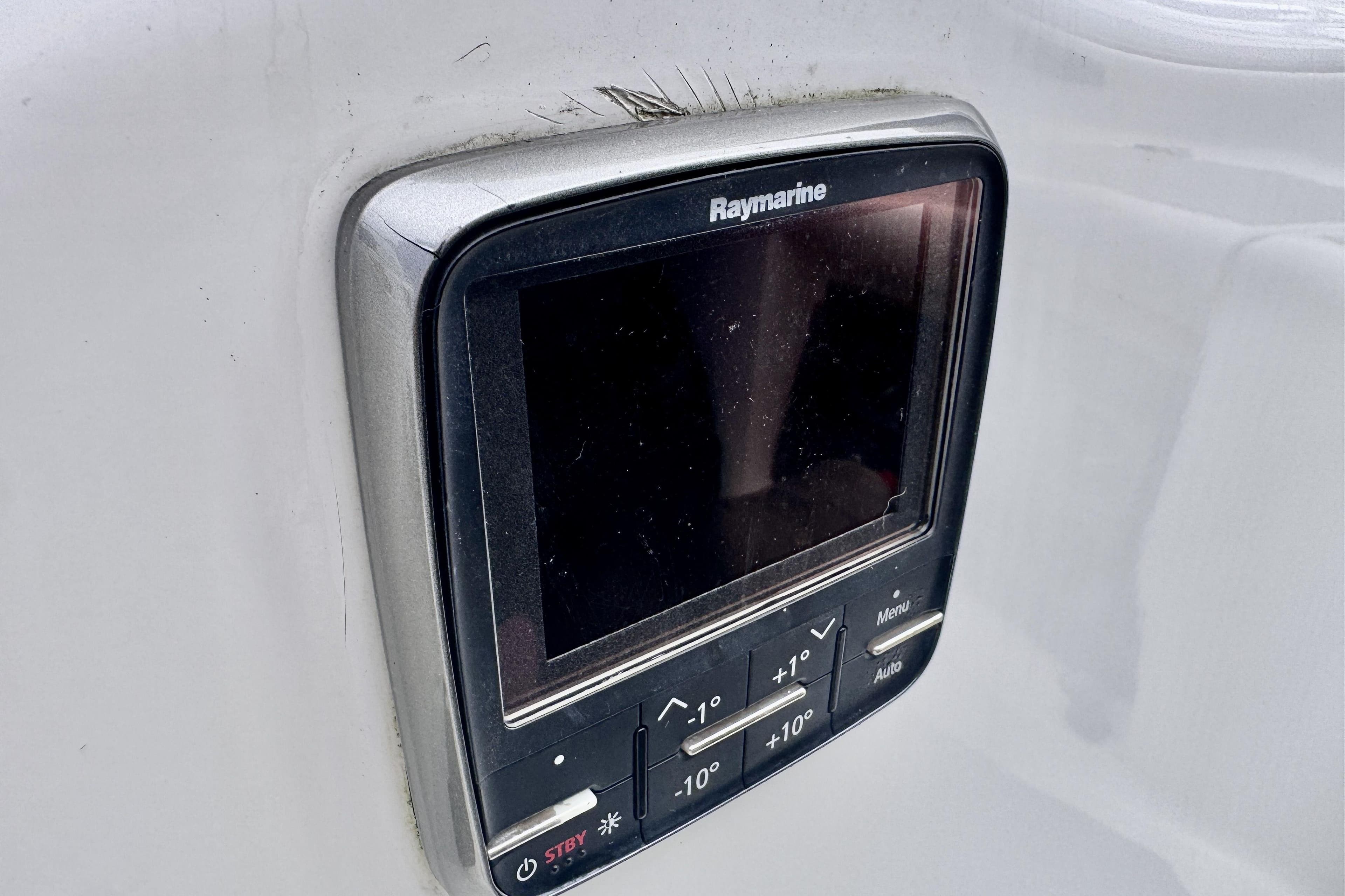 Raymarine display on 1991 Freedom 38 yacht, featuring navigation controls.