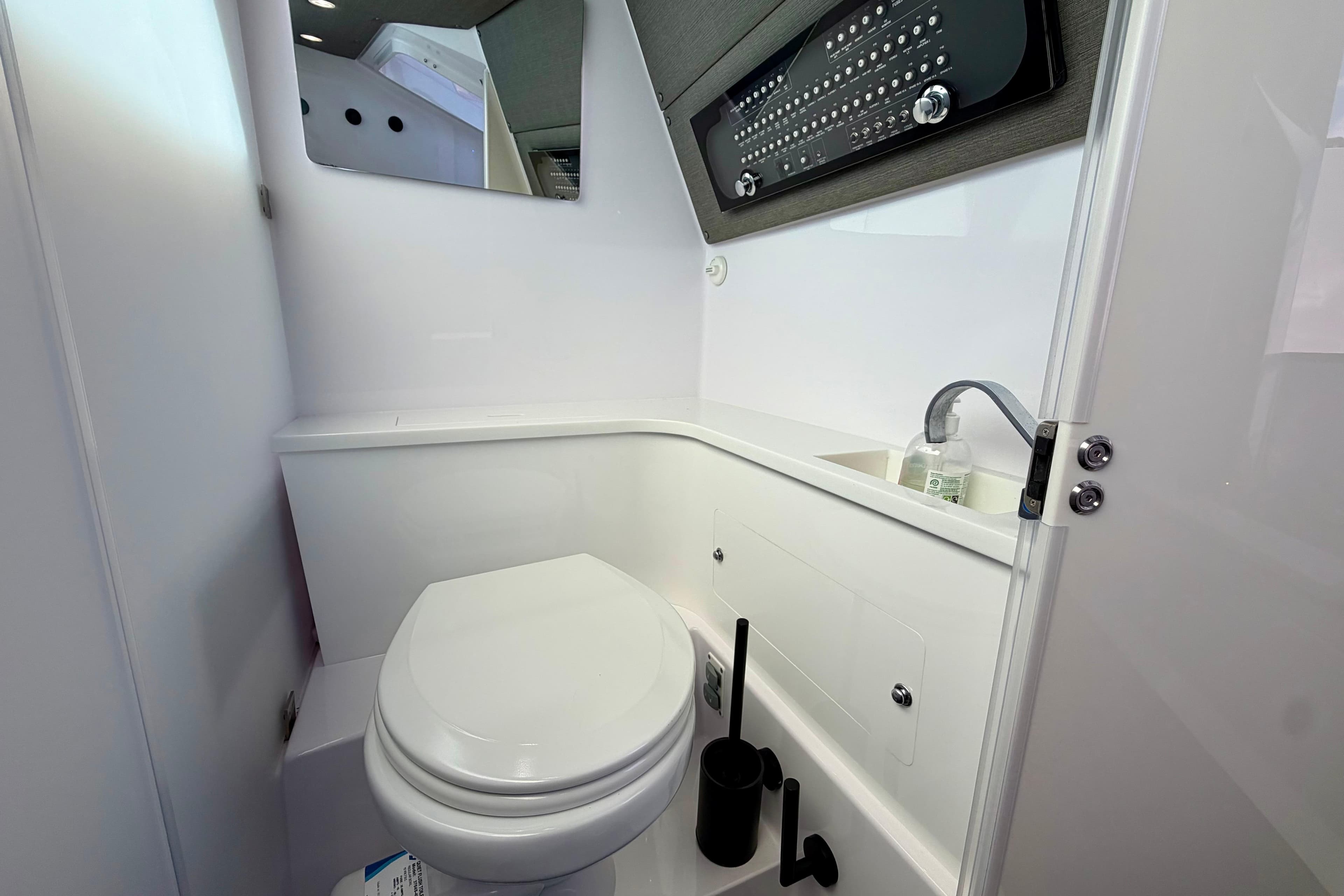 2024 Axopar 37 XC Cross Cabin bathroom with modern fixtures and sleek design.