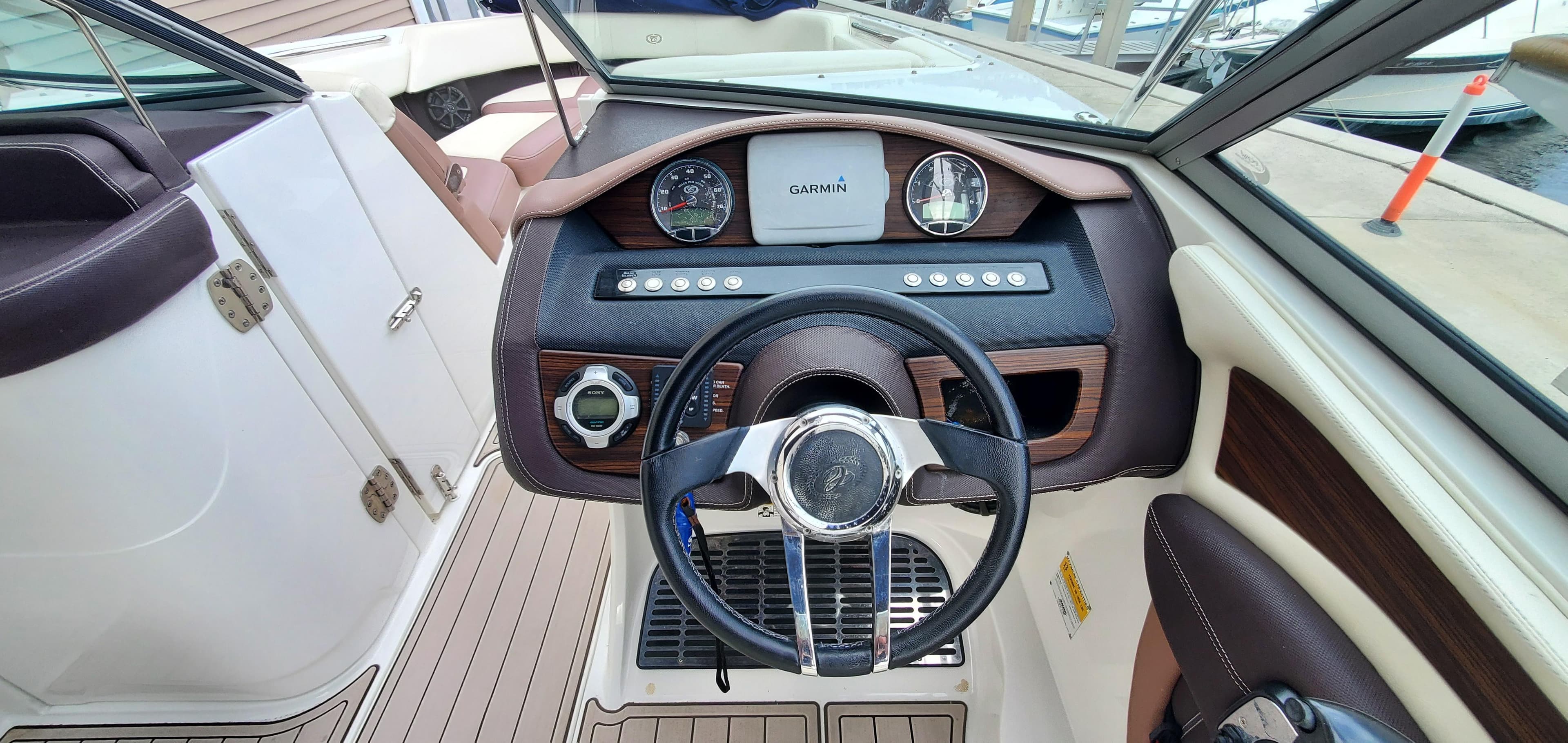 Interior view of 2013 Cobalt 24SD boat dashboard with Garmin navigation system.