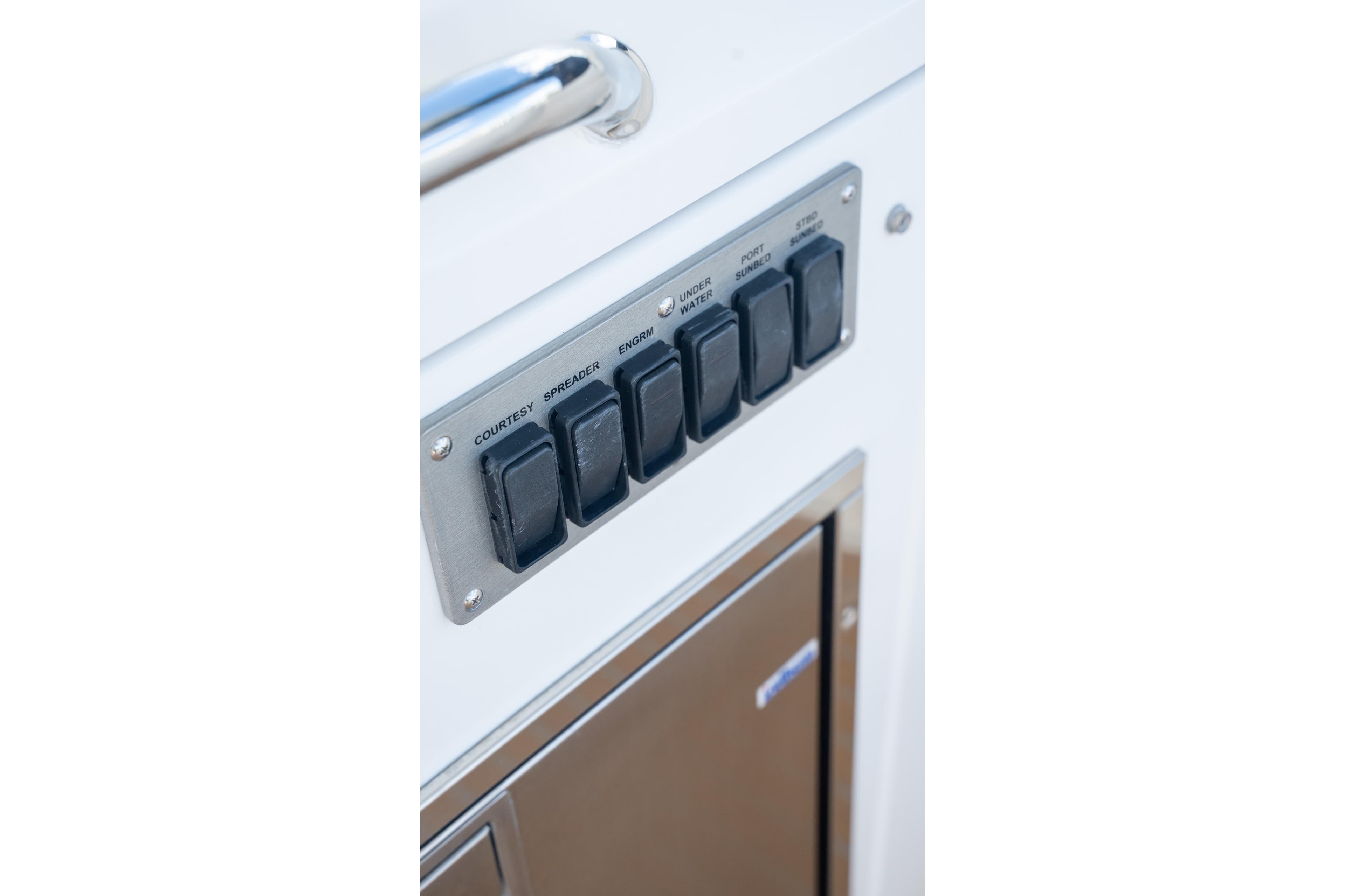 Control panel on 2018 Cruisers Yachts 390 Express Coupe, featuring labeled switches.
