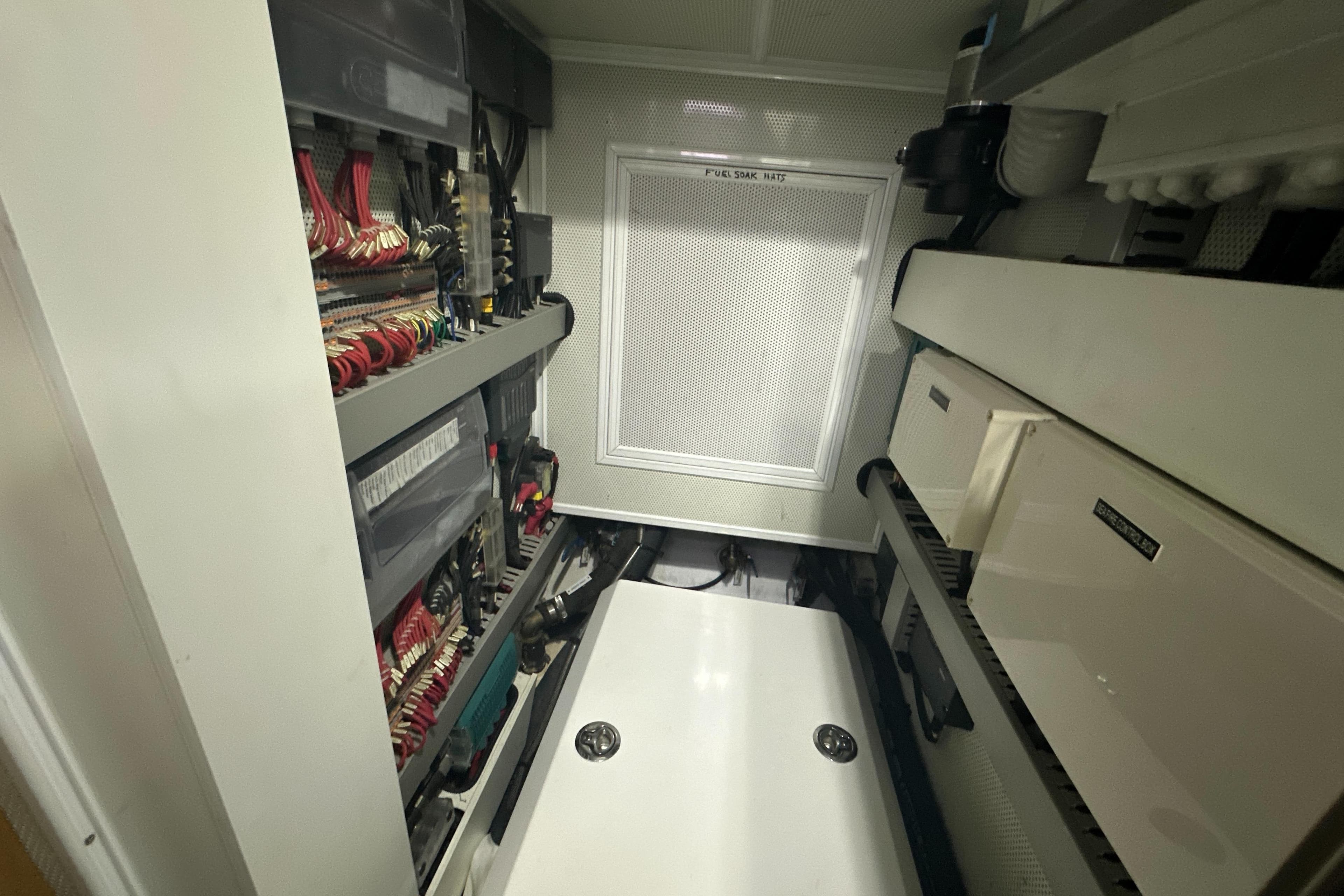 Engine room of a 2019 Kraken 50 yacht, showcasing electrical systems and components.