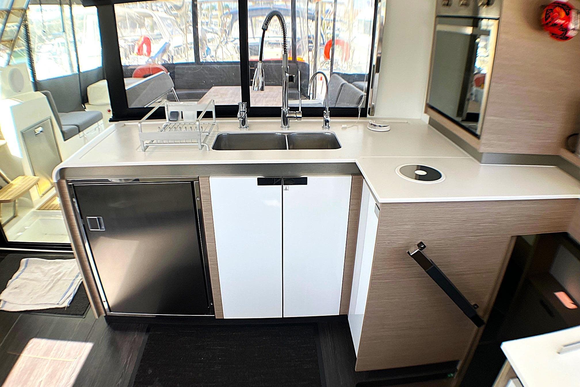 Modern kitchen interior of 2023 Fountaine Pajot Elba 45 Catamaran with sleek design.