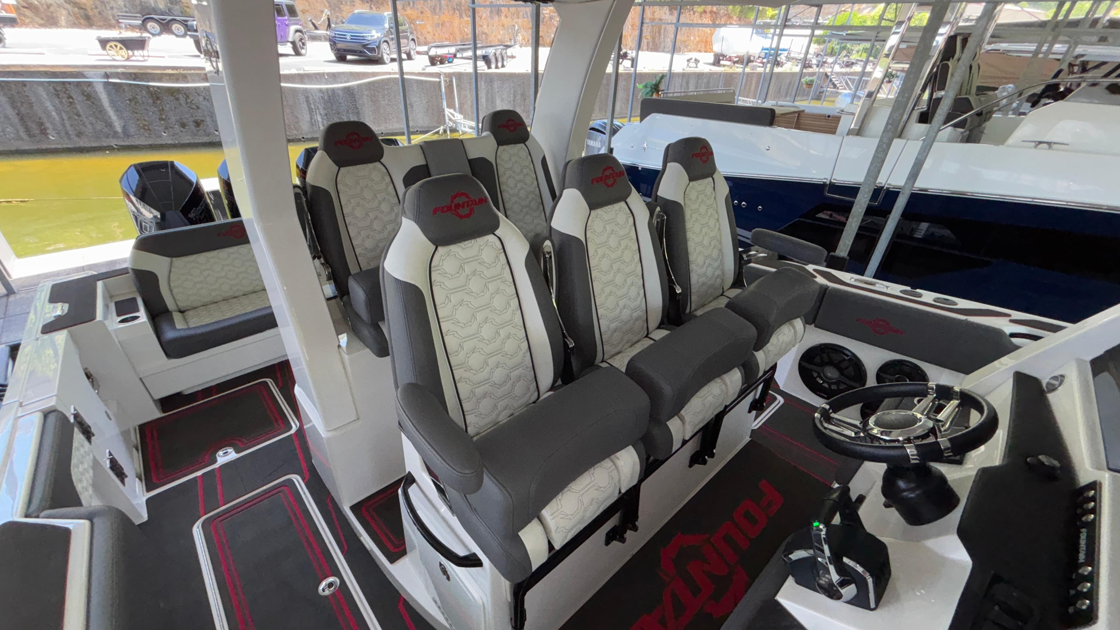 2024 Fountain 43 SCX boat interior with luxurious seating and modern steering console.
