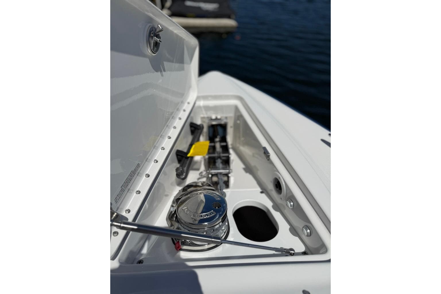 2025 Formula 330 Crossover Bowrider OB anchor compartment detail on water.