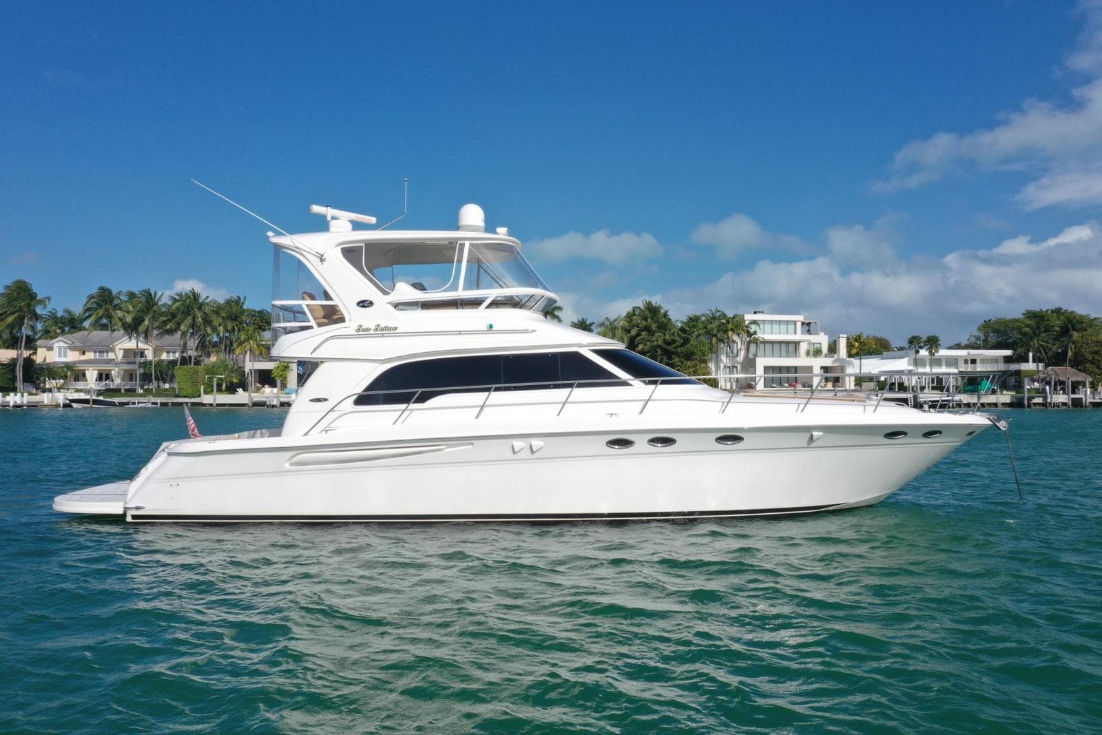 2001 Sea Ray 480 Sedan Bridge yacht on clear blue water.