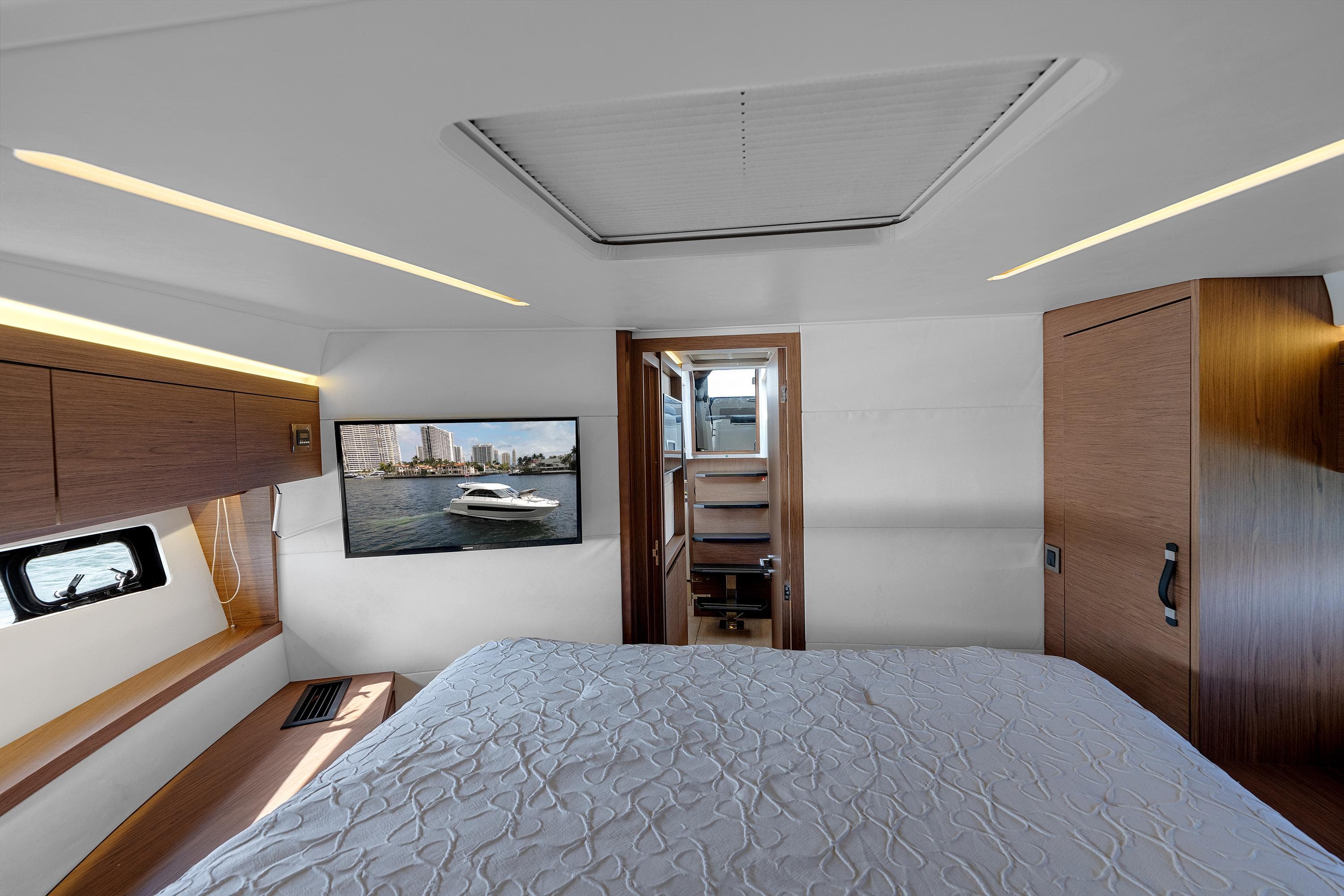 Luxurious interior of 2018 Jeanneau Leader 46 yacht with modern bedroom design.