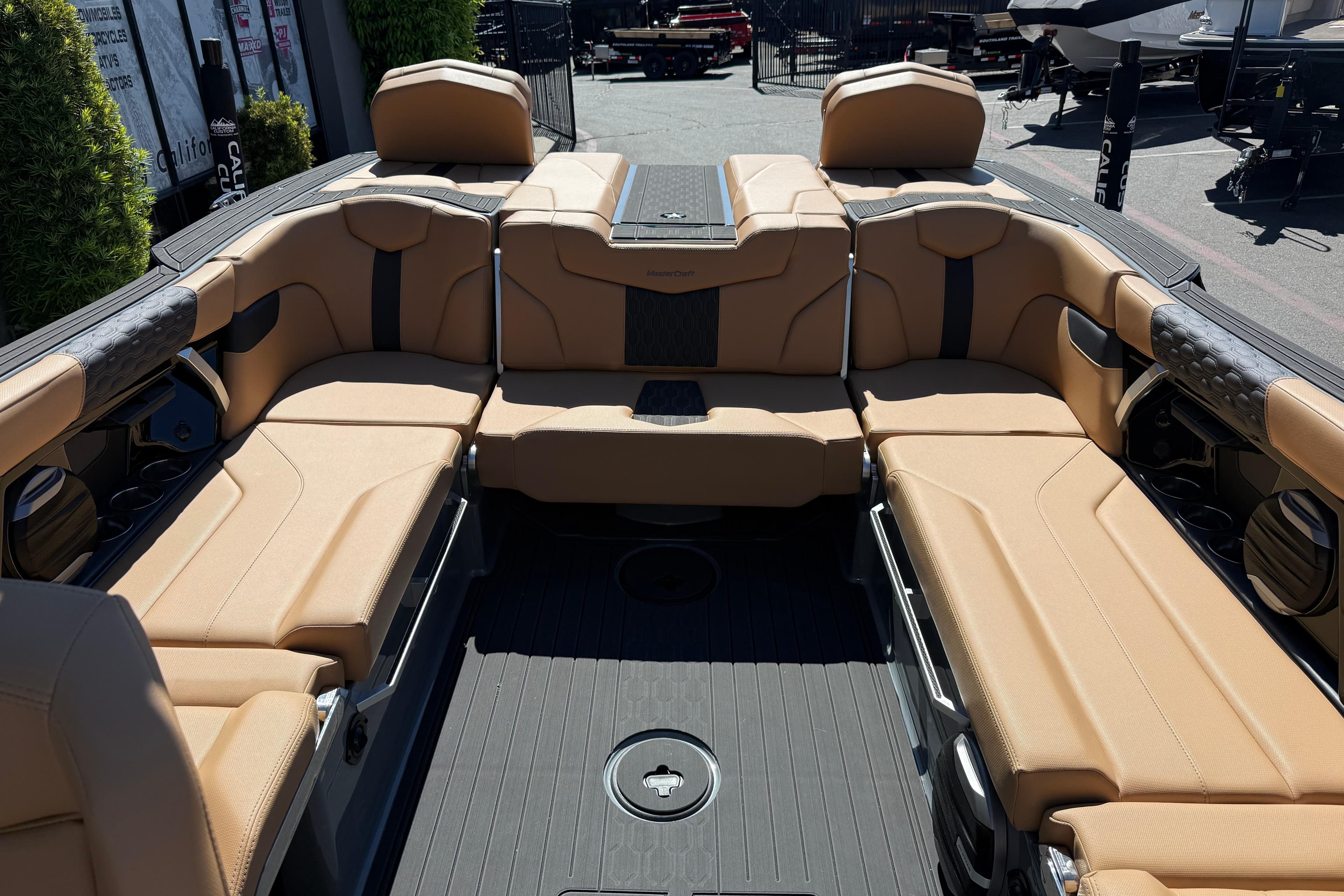 Luxurious interior of 2026 MasterCraft XT24 boat with tan seating and sleek design.