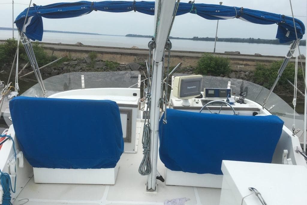 1997 Willard Marine 40 Pilothouse Trawler with blue seating and navigation equipment.