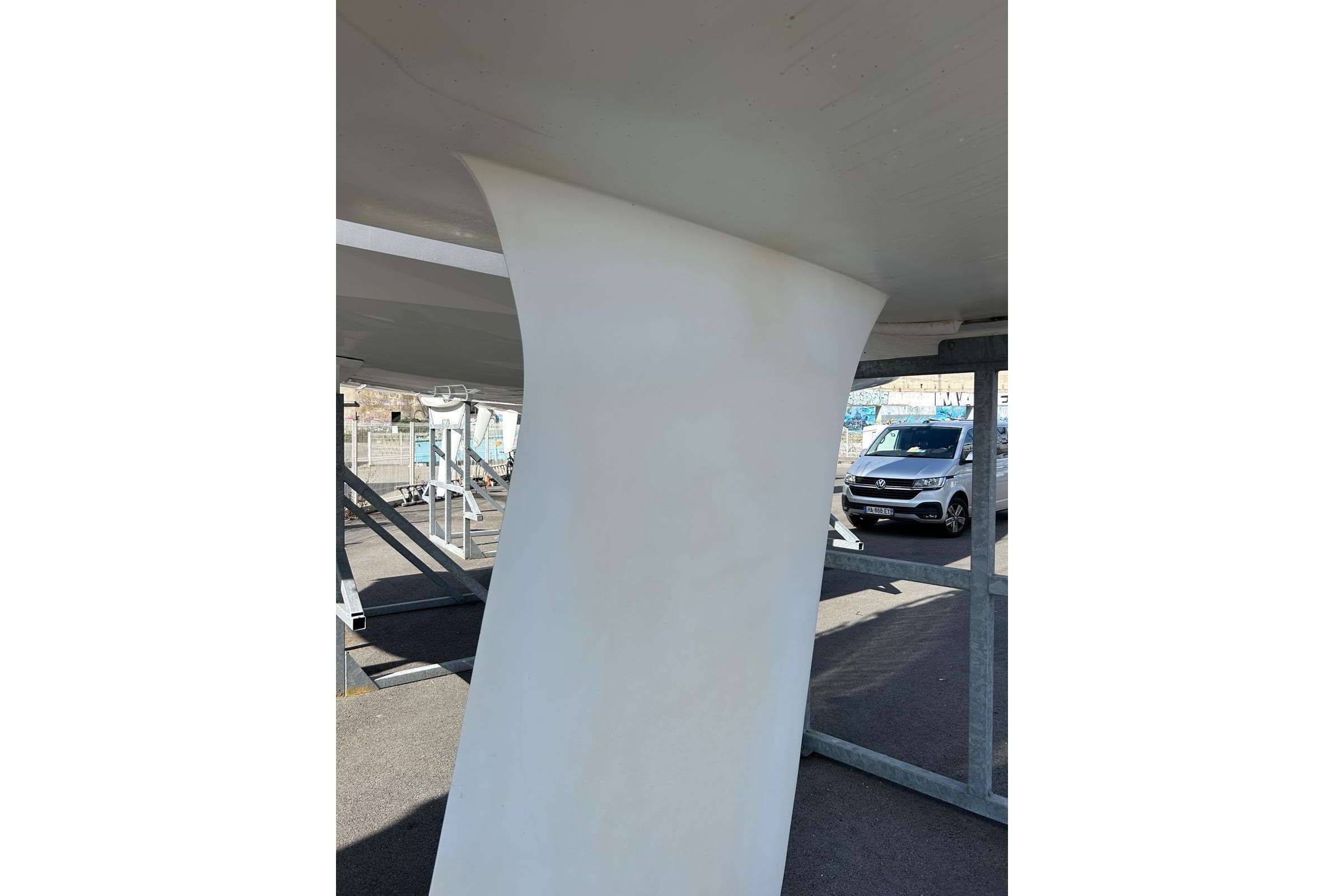 Close-up of 2019 JPK 11.80 yacht keel in a marina setting.