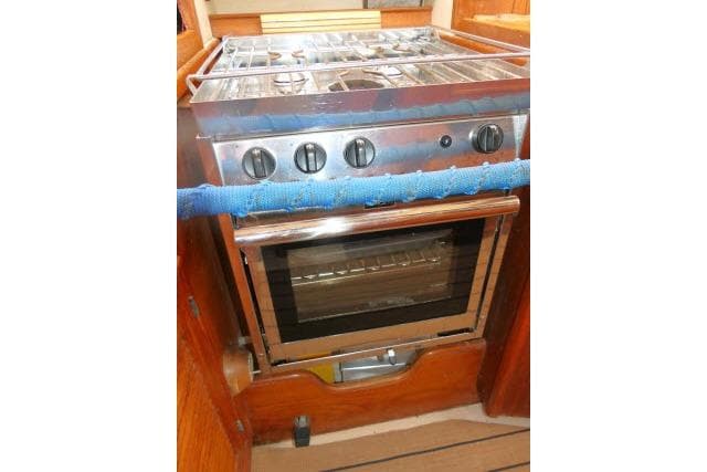 Stainless steel stove and oven in 1999 Island Packet 45 yacht kitchen.