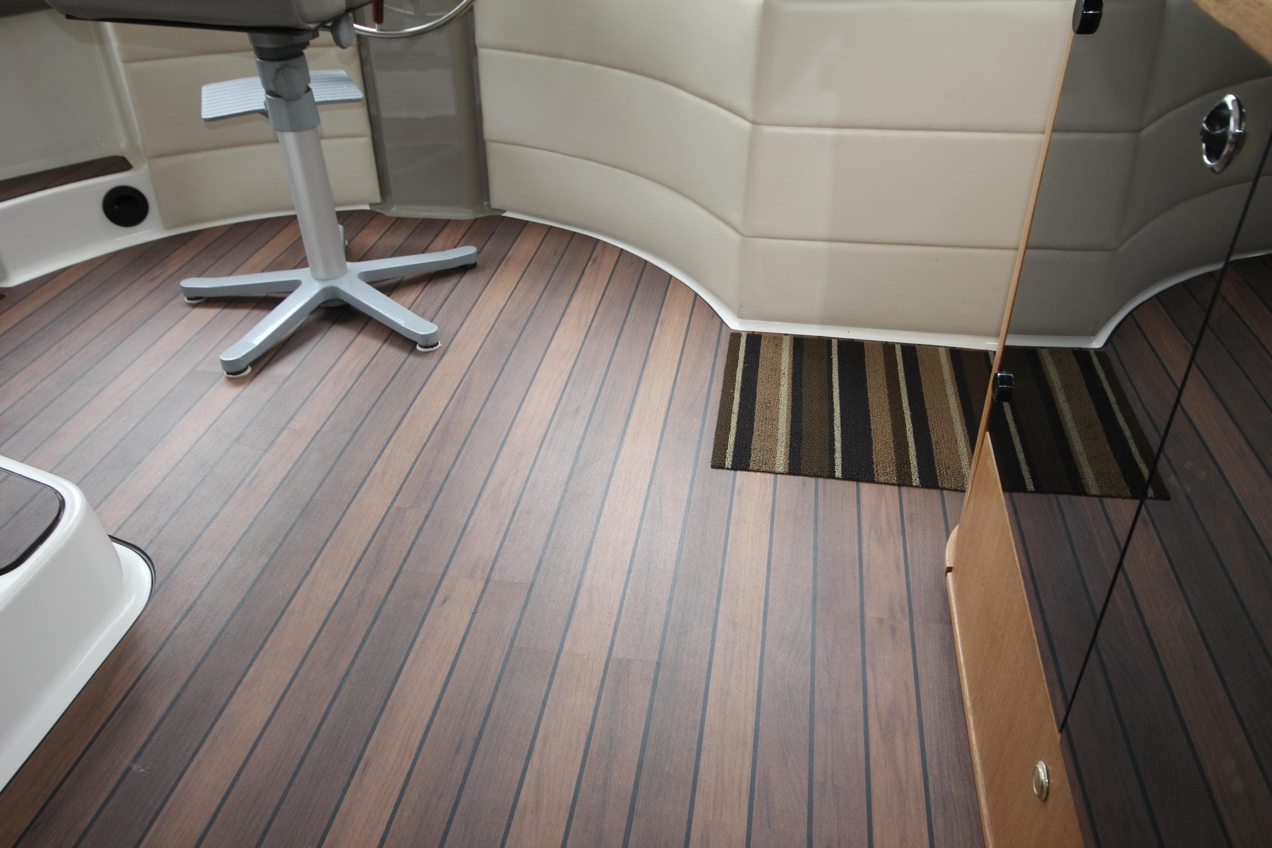 Interior of 1999 Bayliner 4788 Motoryacht with wooden flooring.