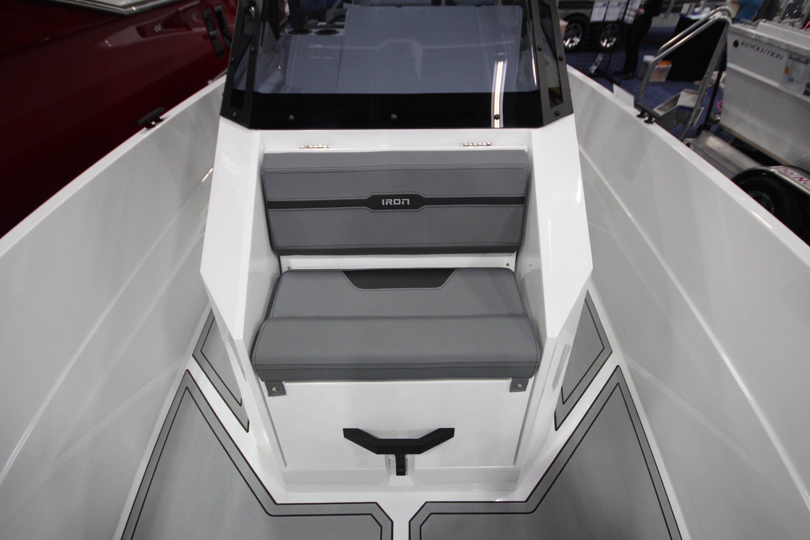 2026 Iron 827 T-Top boat interior with gray seating and modern design.