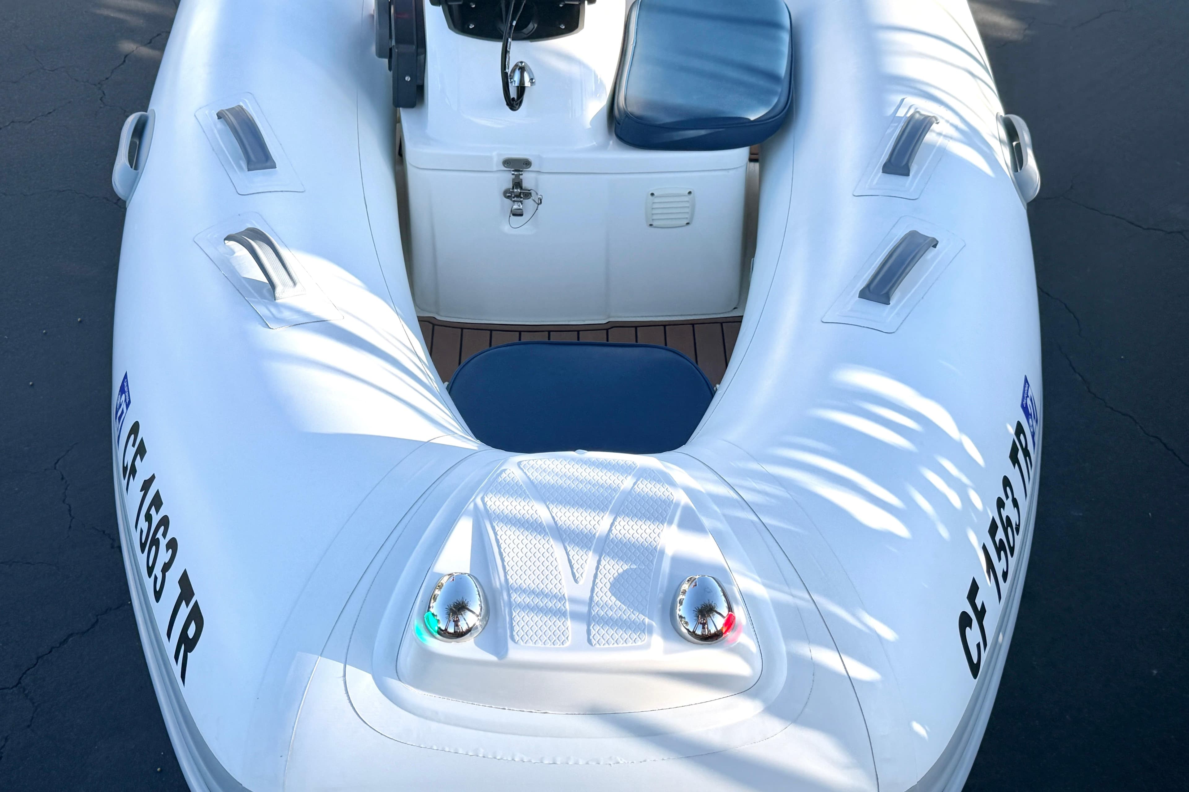 2018 Brig Falcon 360 inflatable boat with blue seating and registration number visible.