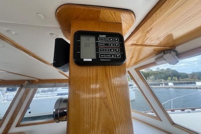 Control panel on 1989 Duffy Wilbur 42 Flybridge Cruiser, featuring wood interior and window view.