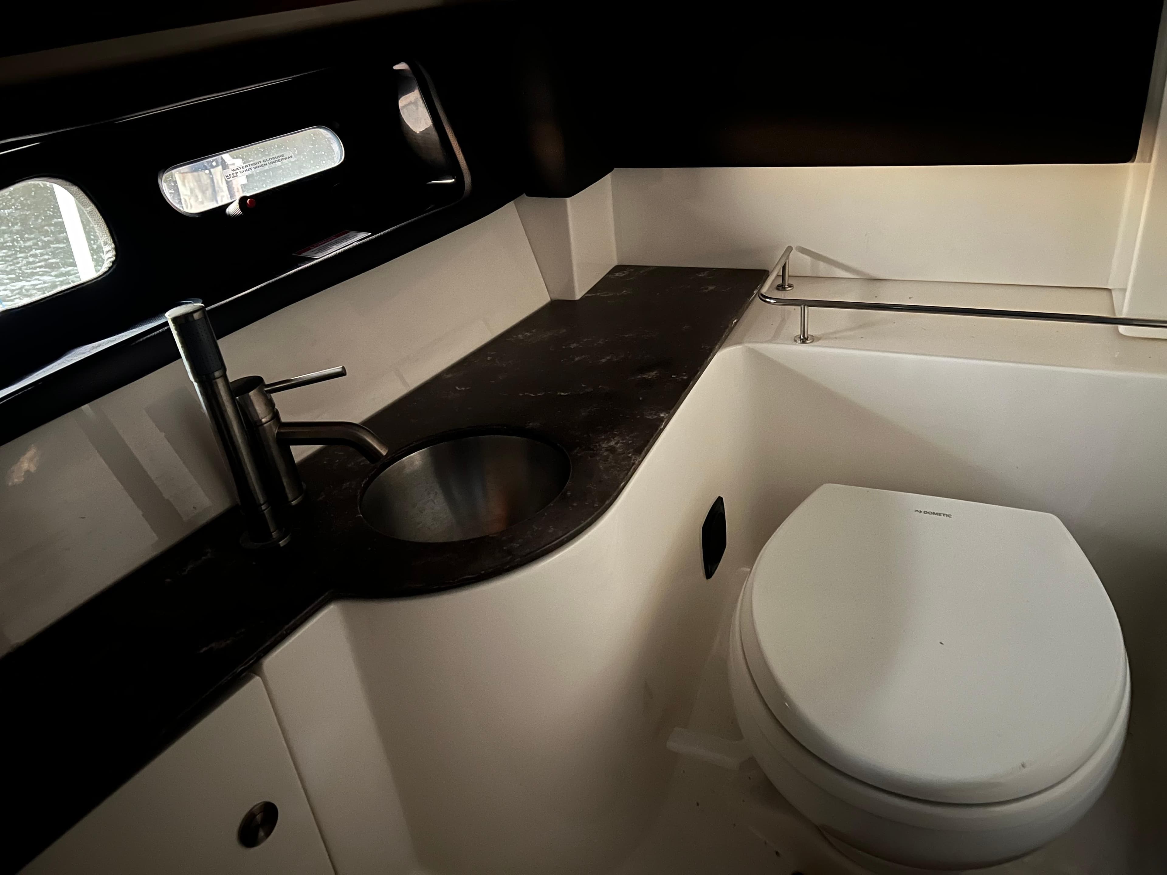 2017 Sea Ray 350 SLX boat bathroom with sink and toilet.