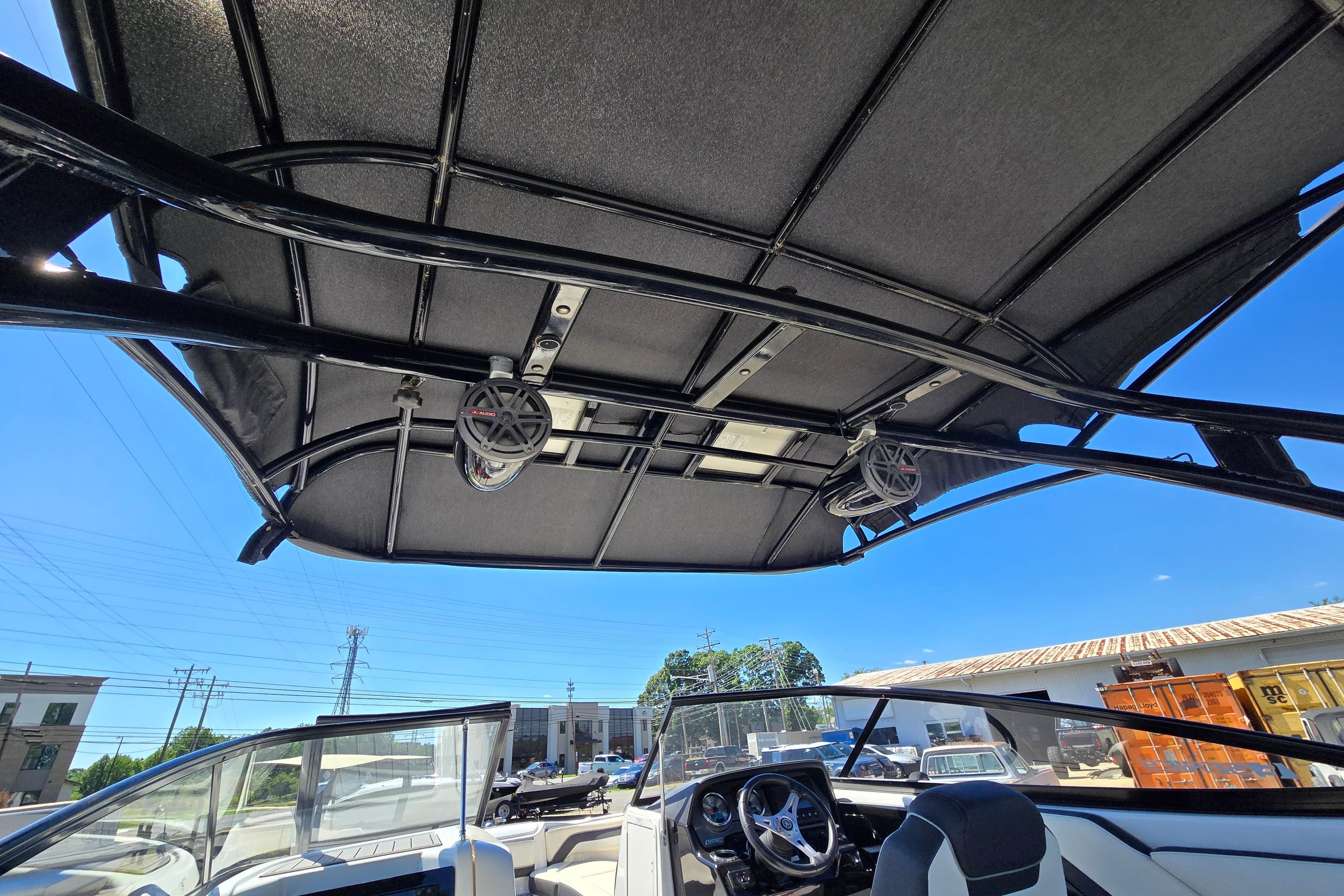2016 Yamaha Boats 242 Limited S E-Series interior with speakers and steering wheel.