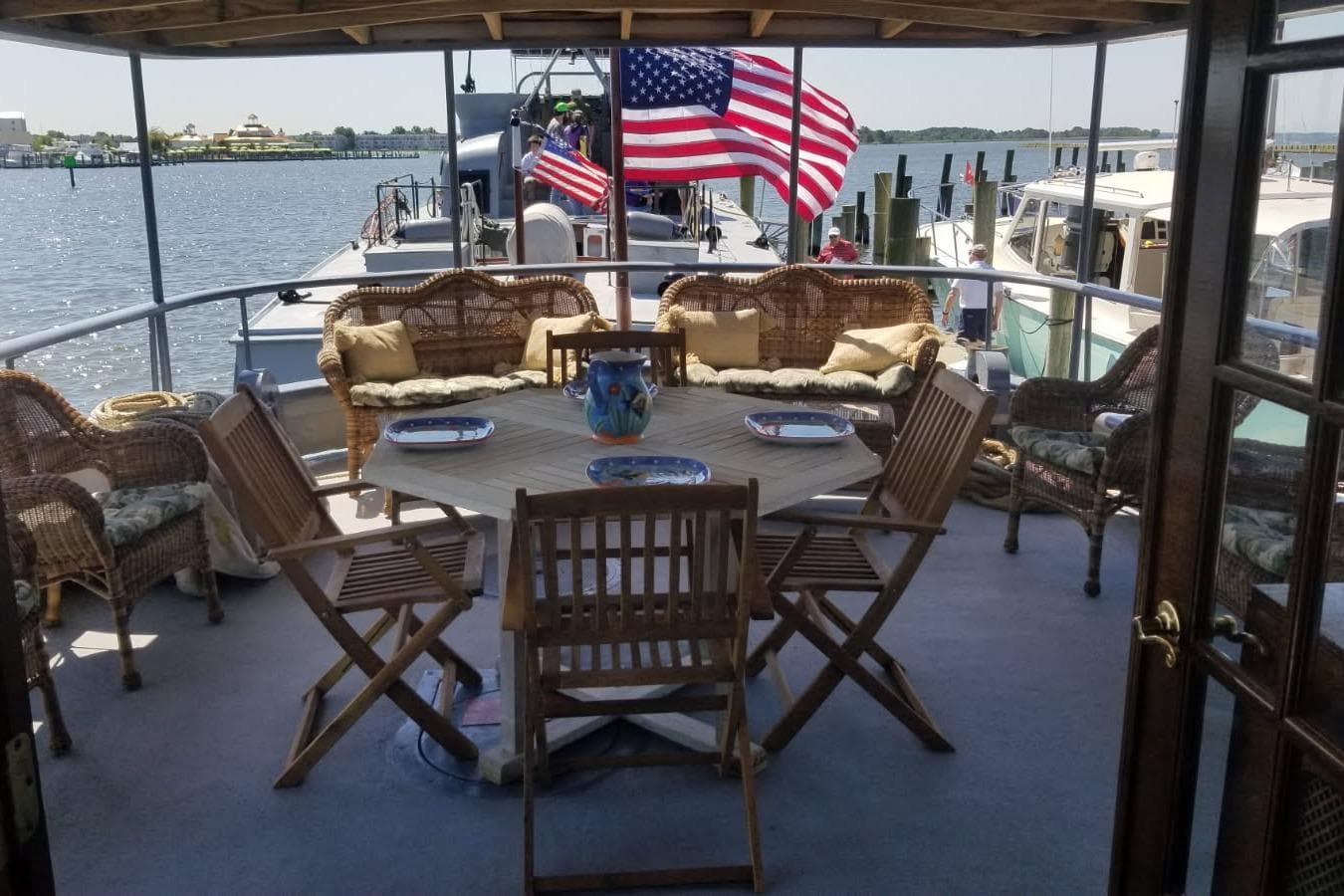 1958 Stephens Brothers Naval Yard Patrol Craft with deck seating and American flag.