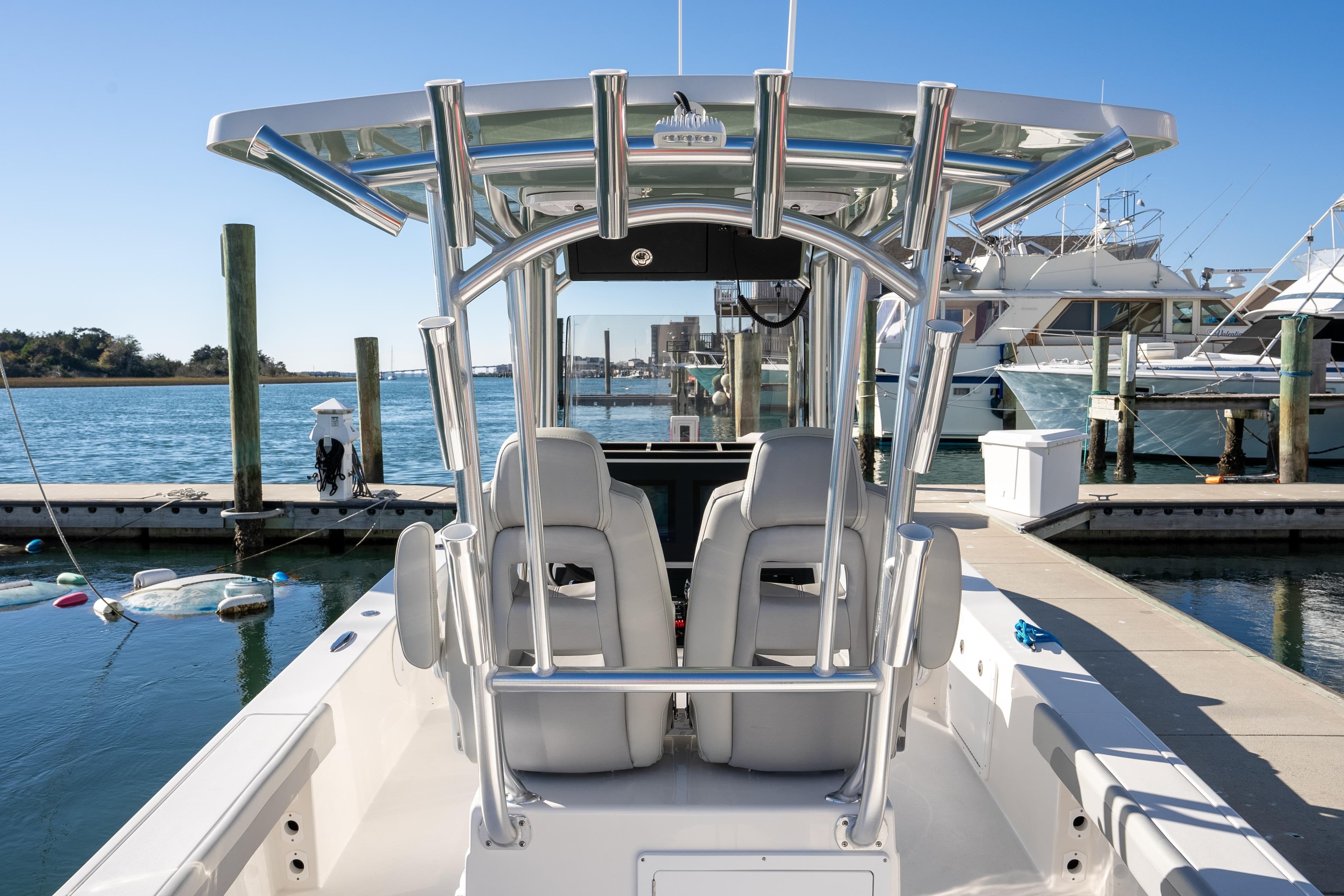2026 Bay Rider 269 Bay boat docked at marina, featuring sleek design and modern amenities.