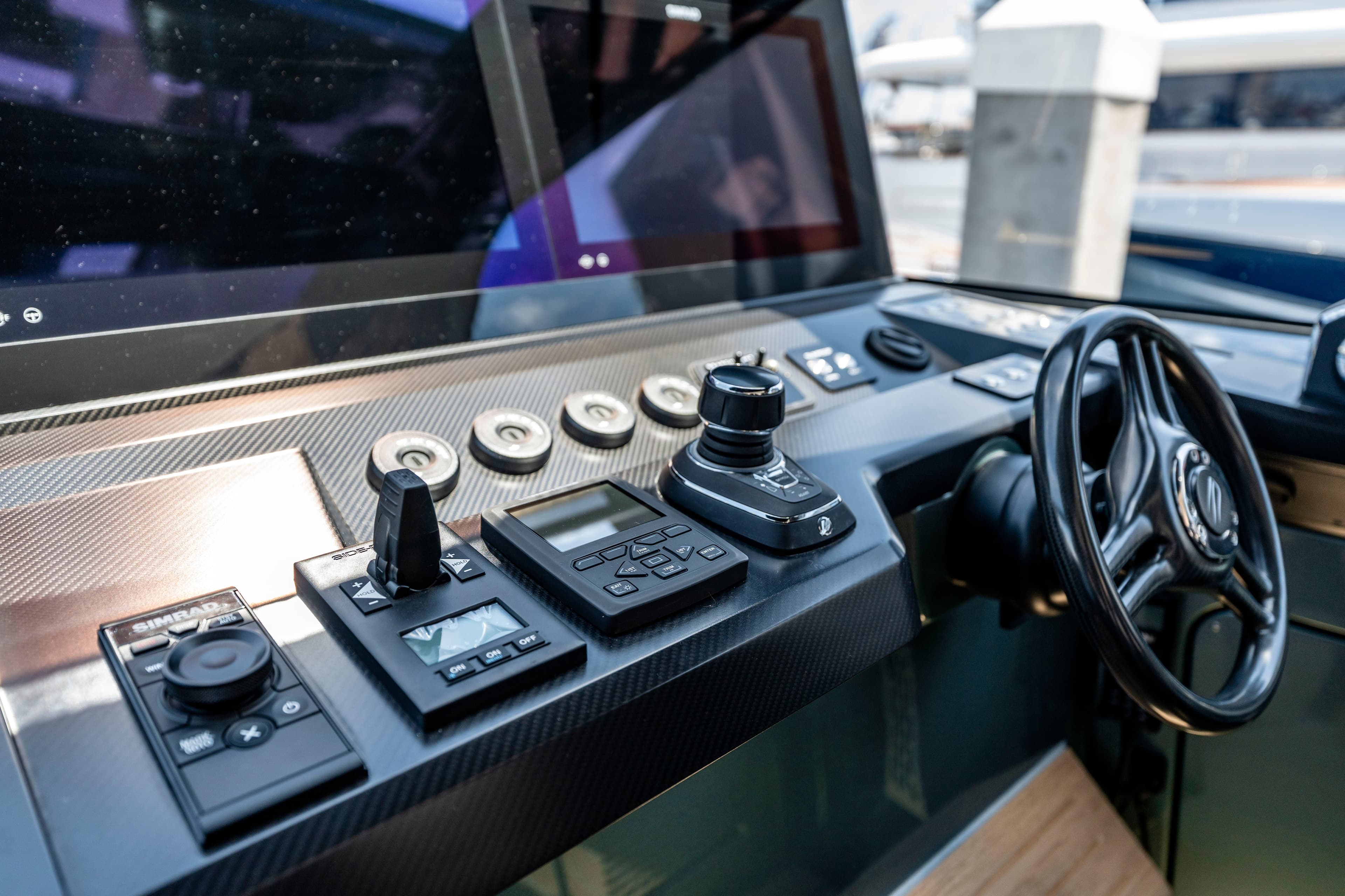 2024 Wally WALLYPOWER 58X yacht cockpit with advanced controls and steering wheel.