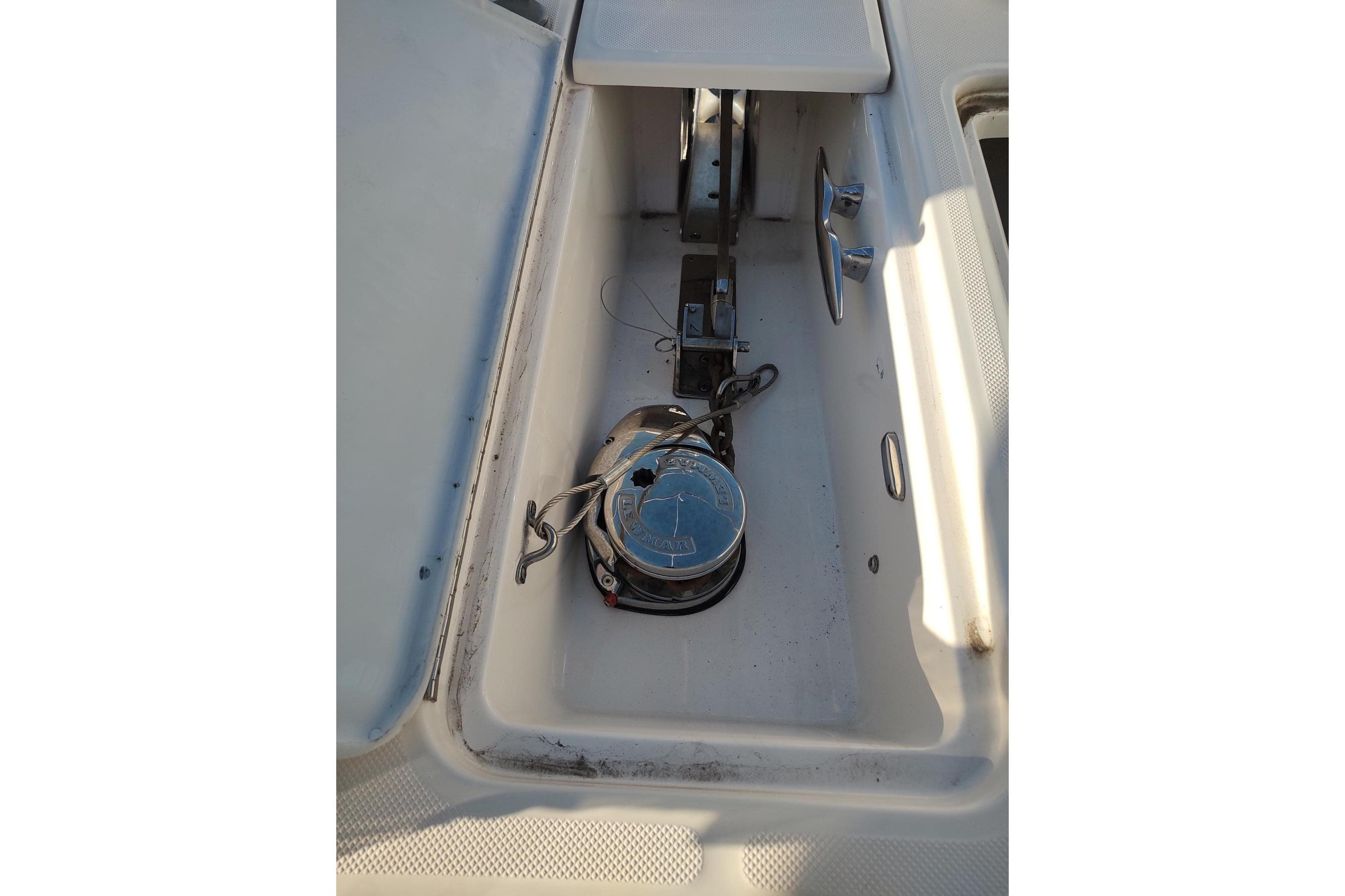Anchor compartment of 2021 Regal 42 Fly yacht, featuring a winch and cleat.