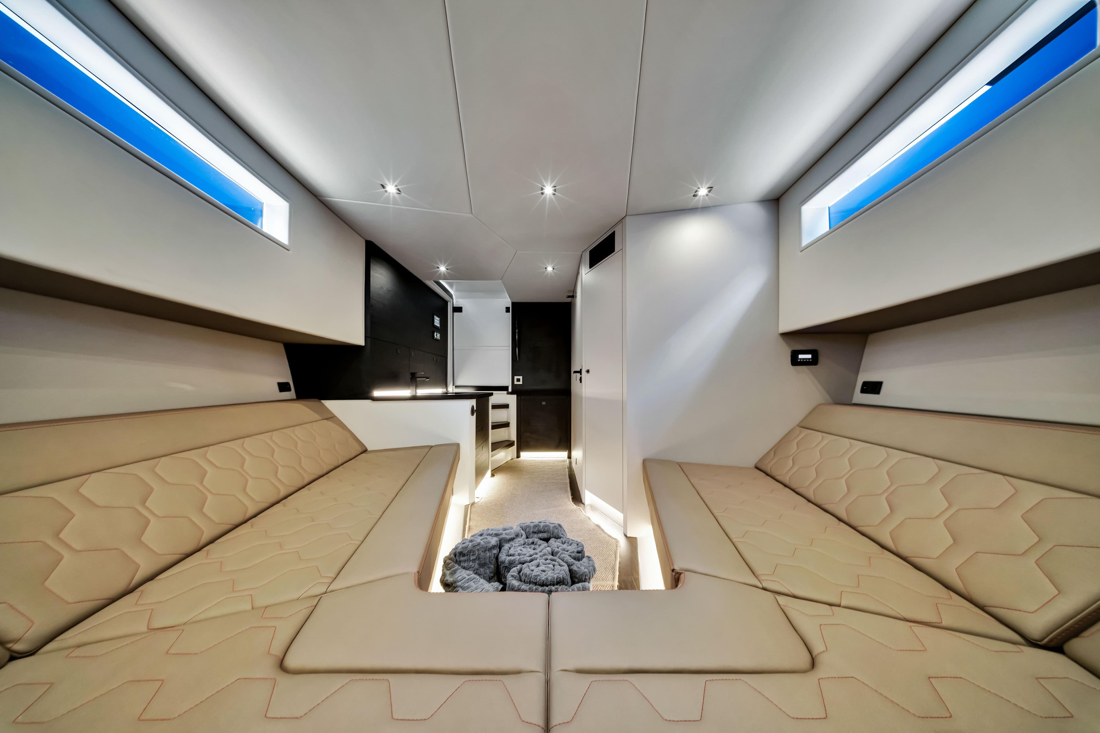 Luxurious interior of 2021 Vanquish Yachts 45 with modern seating and ambient lighting.