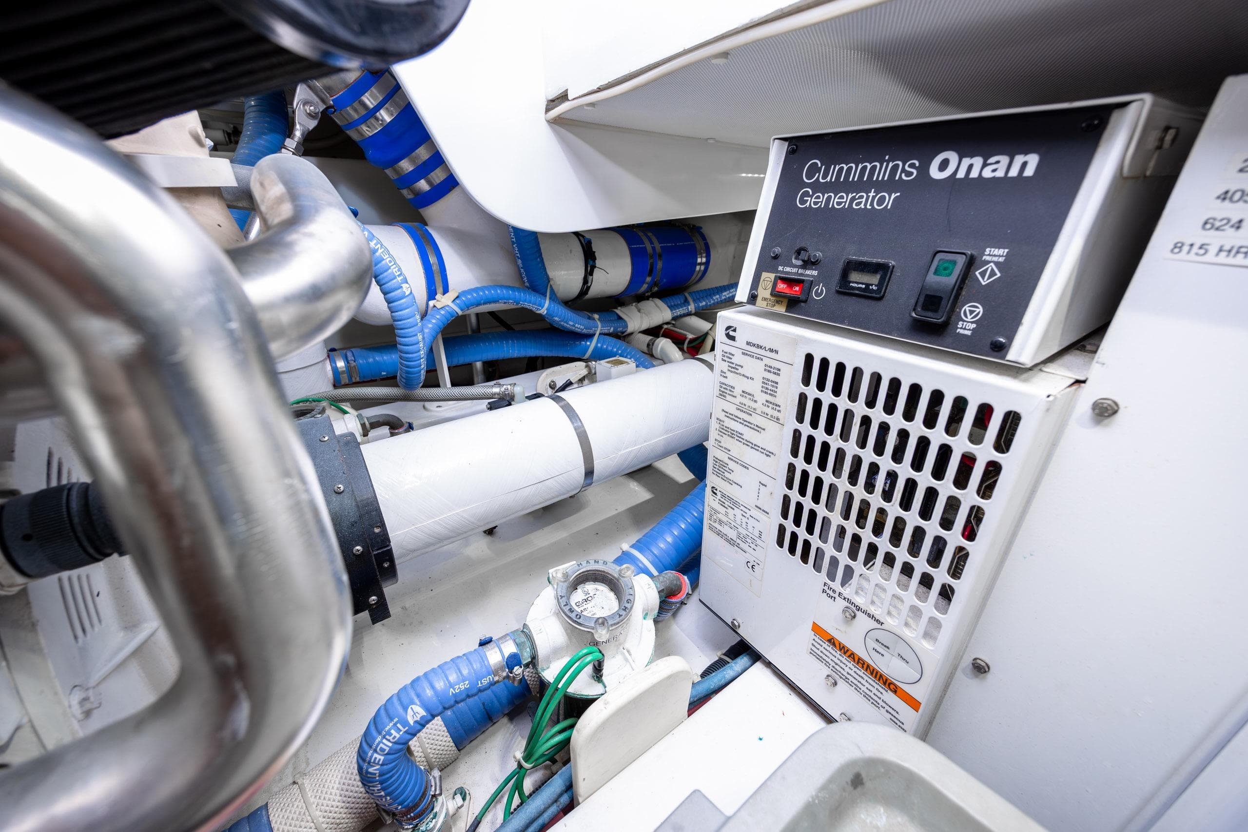 Engine room of 2015 Jarrett Bay Hardtop Express Sportfish with Cummins Onan generator.