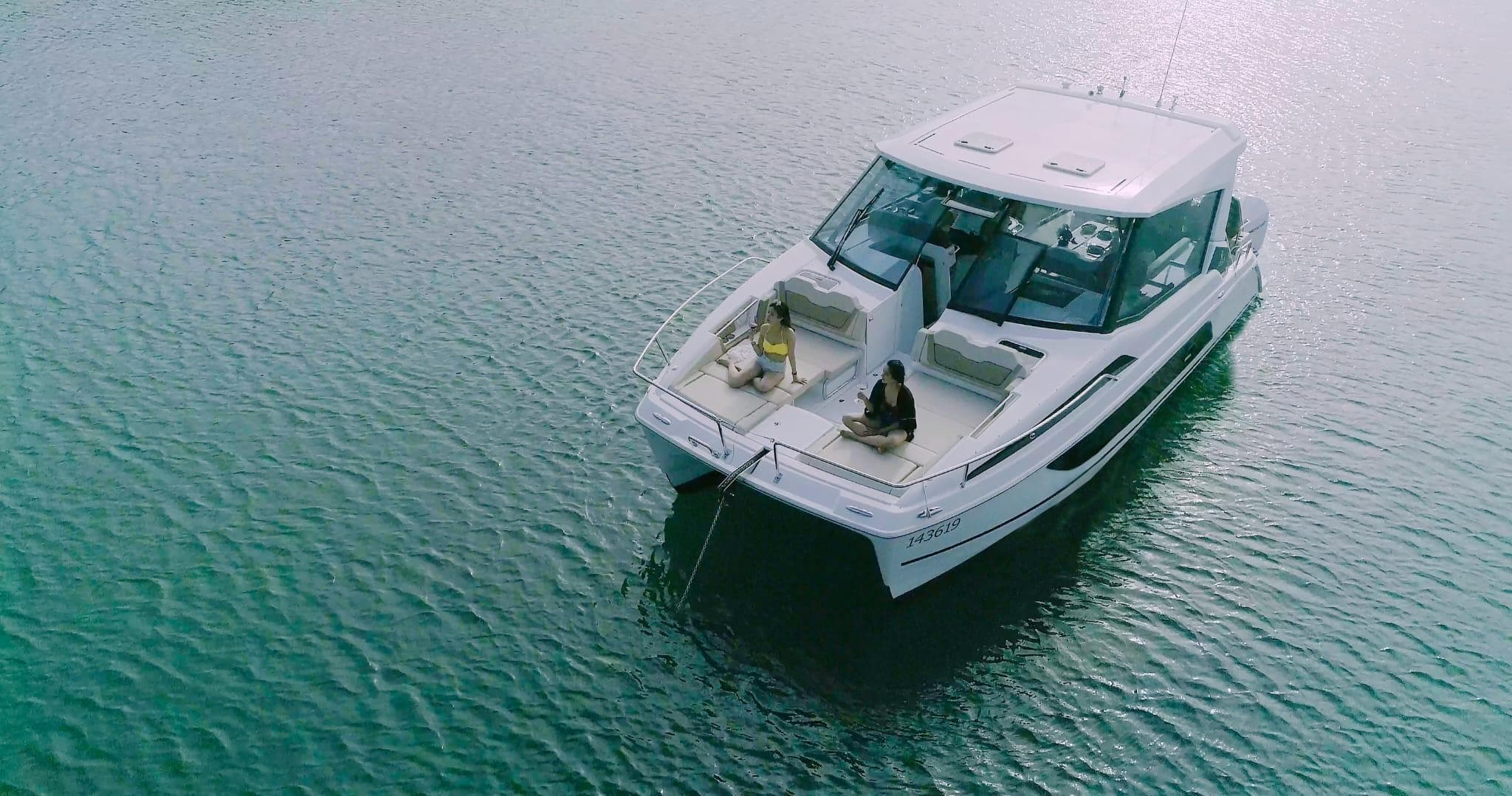 2020 Aquila 36 Sport boat on calm water, aerial view.