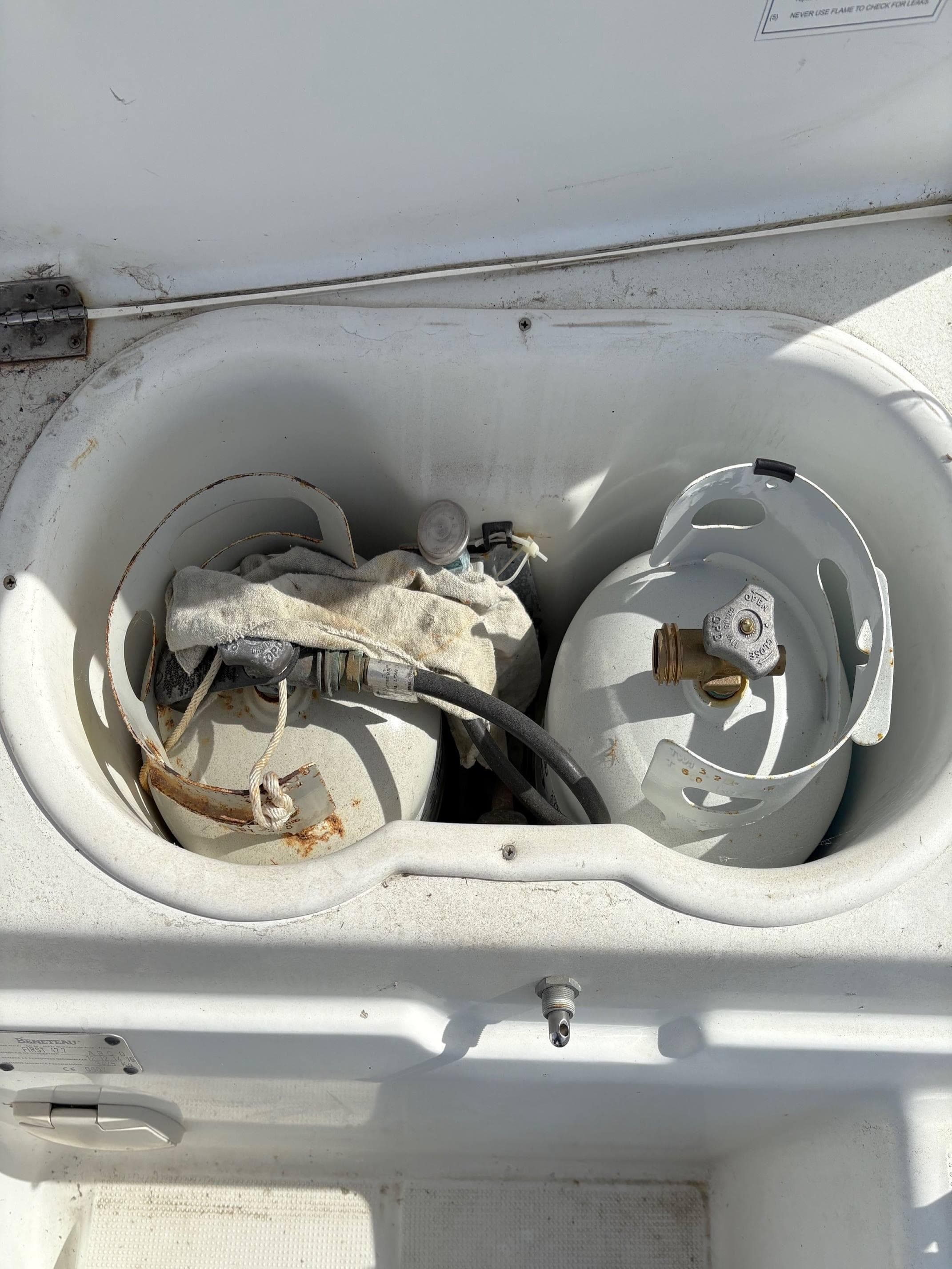 Propane storage compartment on a 2005 Beneteau First 47.7 sailboat.