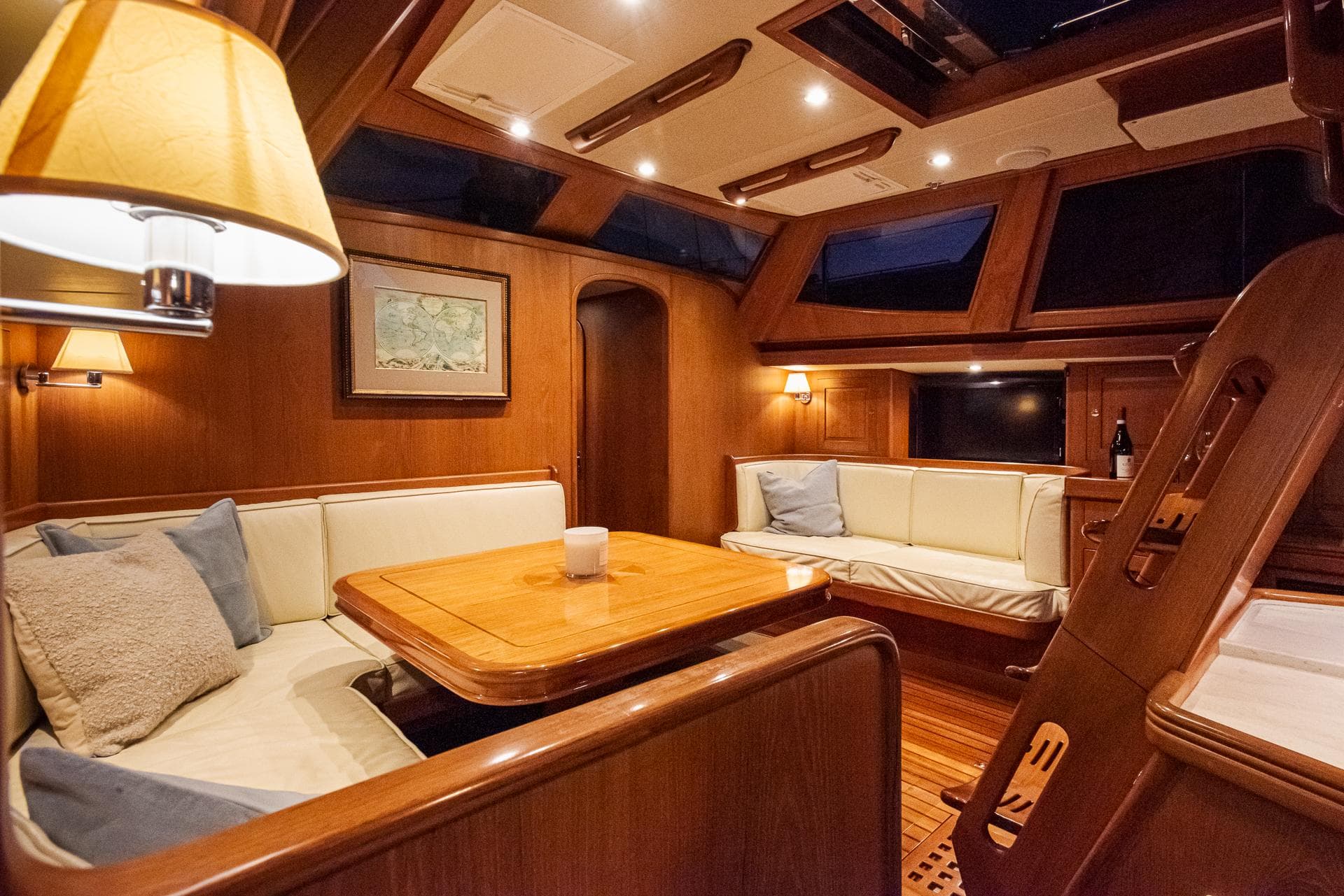 Luxurious interior of a 2011 Hylas 56 yacht with elegant wood finish and cozy seating.